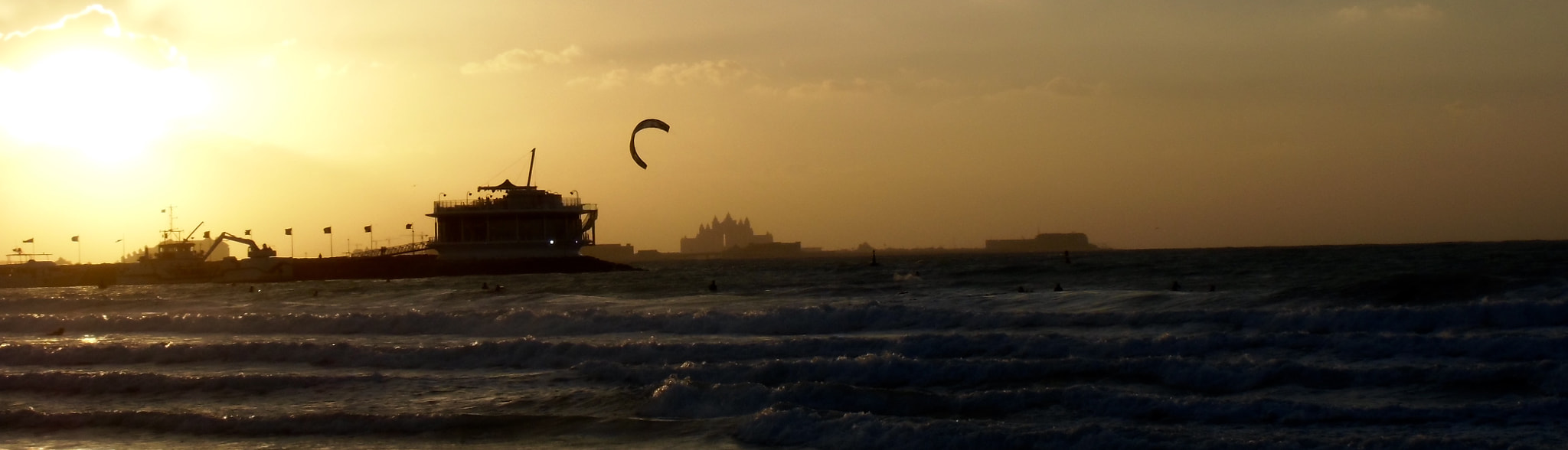 CASIO EX-ZS100 sample photo. Twilight windsurfing with atlantis in the background exotic flypast photography
