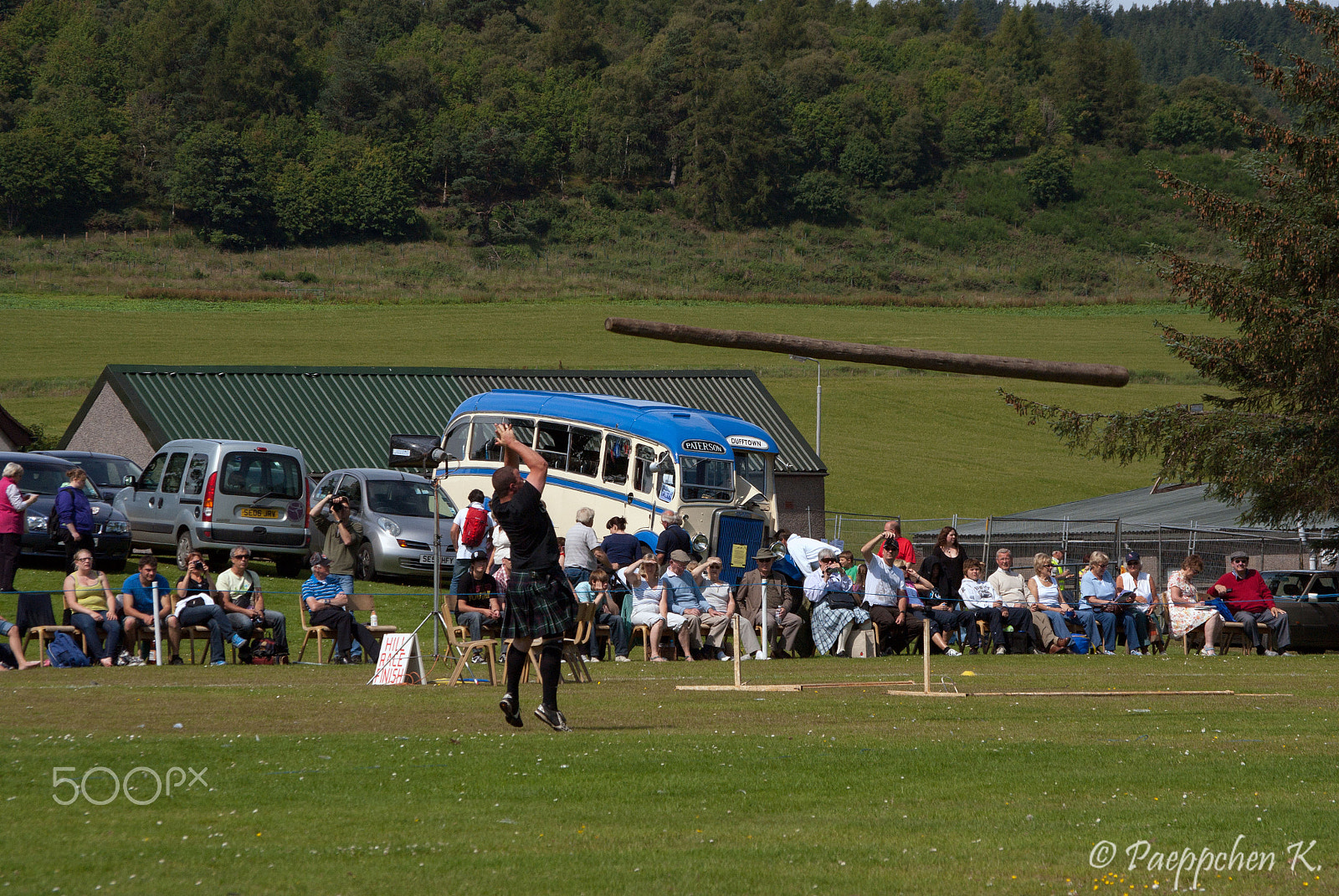 Pentax K-m (K2000) sample photo. Tossing the caber photography