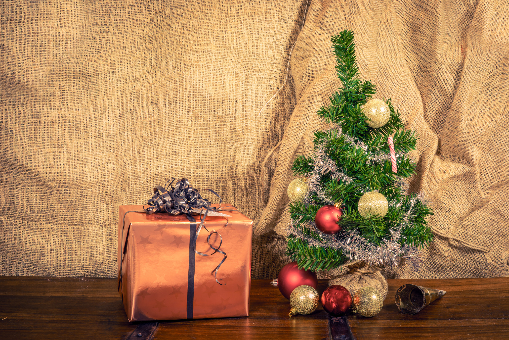 Sony a7R + Sony 50mm F1.4 sample photo. Christmas gift on a wooden table photography