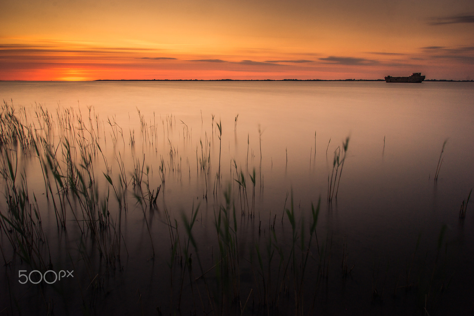 Sony SLT-A77 sample photo. Sunset in front of a concrete boat photography