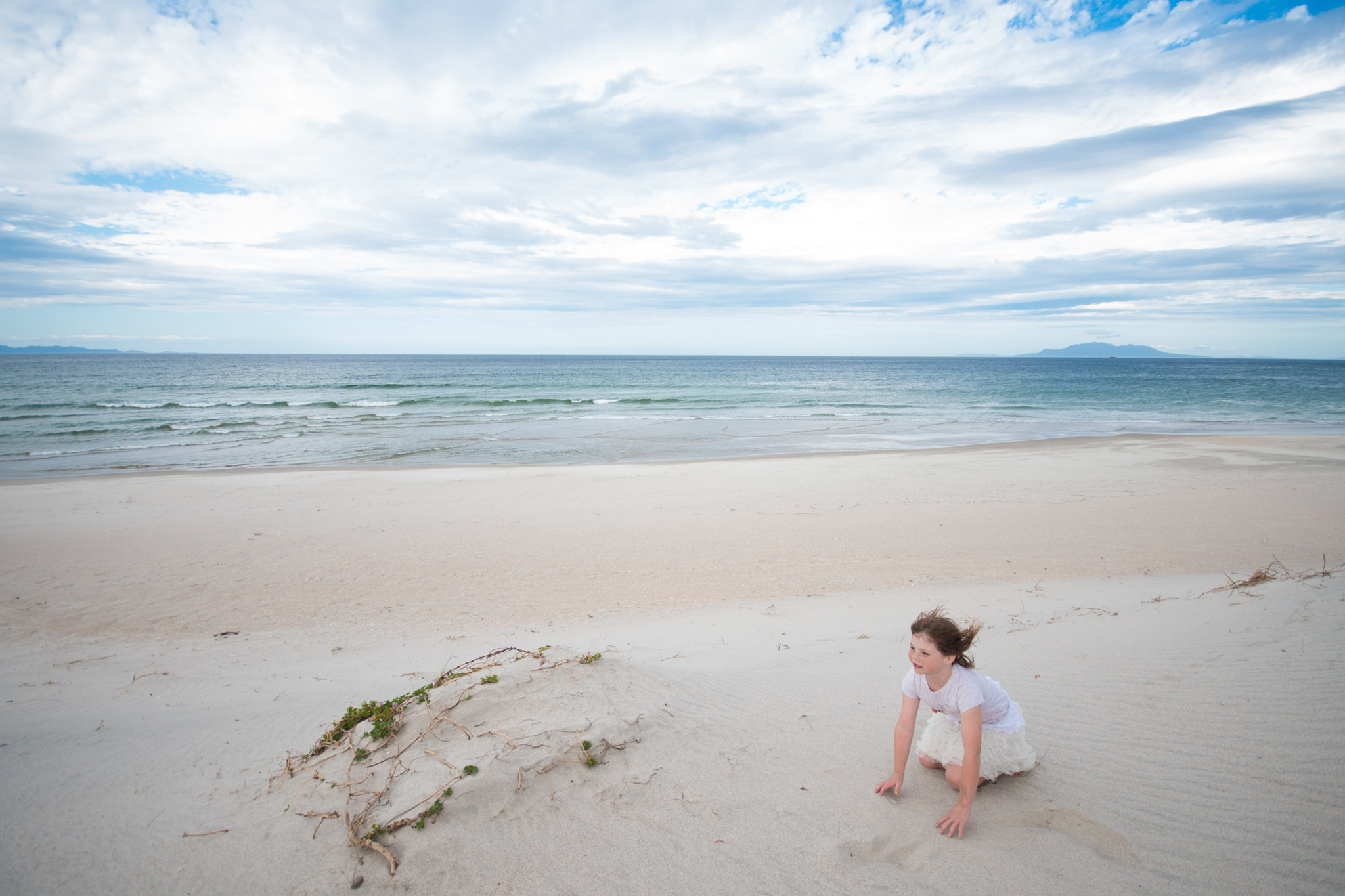 Sigma 10-20mm F4-5.6 EX DC HSM sample photo. Windy day for a young girl at pakiri beach photography