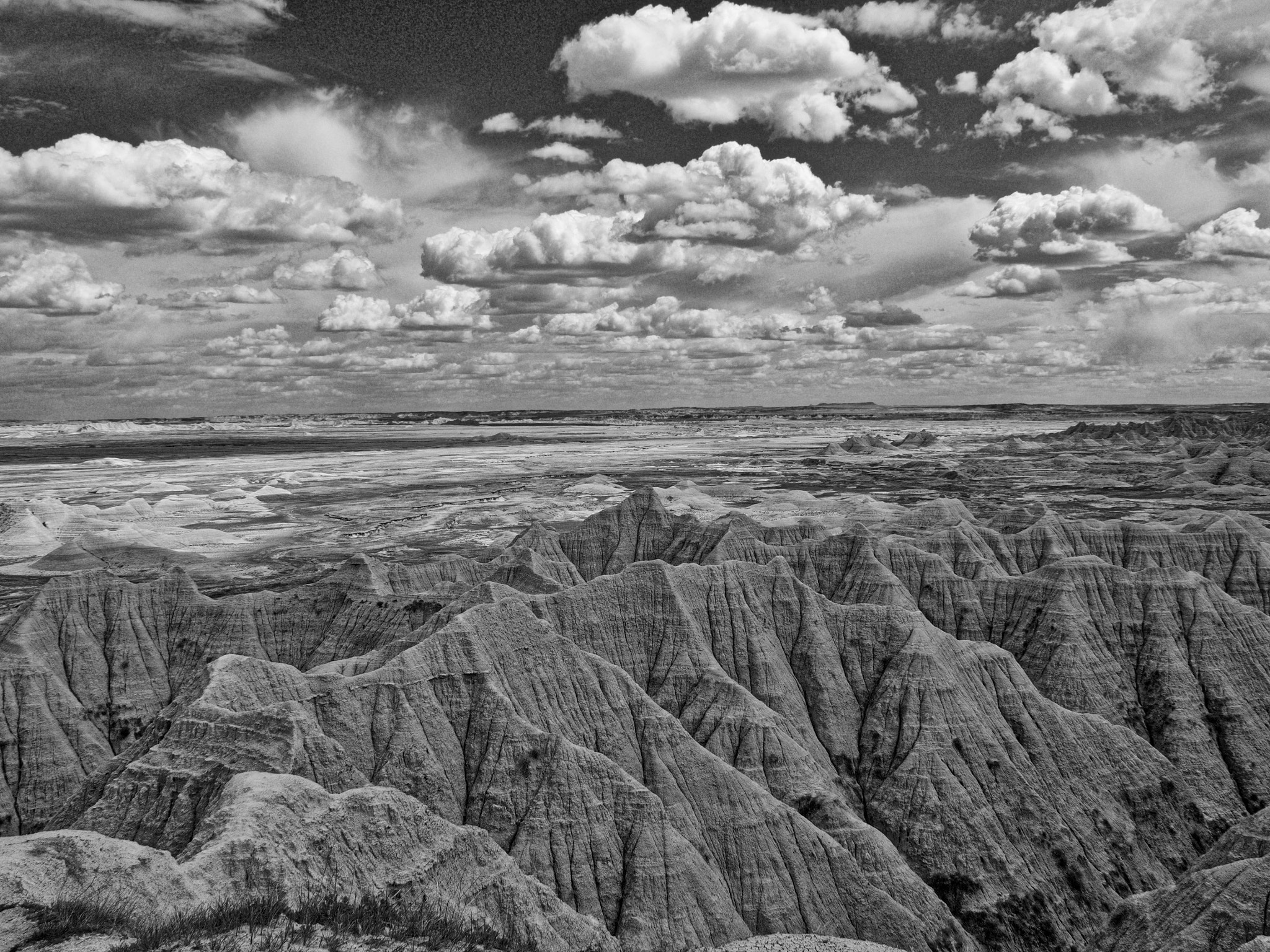 OLYMPUS M.14-150mm F4.0-5.6 II sample photo. Badlands march of clouds photography