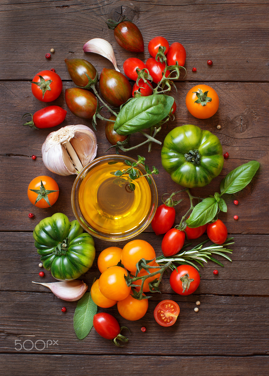 Canon EOS 650D (EOS Rebel T4i / EOS Kiss X6i) + Canon EF 50mm F1.2L USM sample photo. Colorful tomatoes, garlic, olive oil and herbs photography