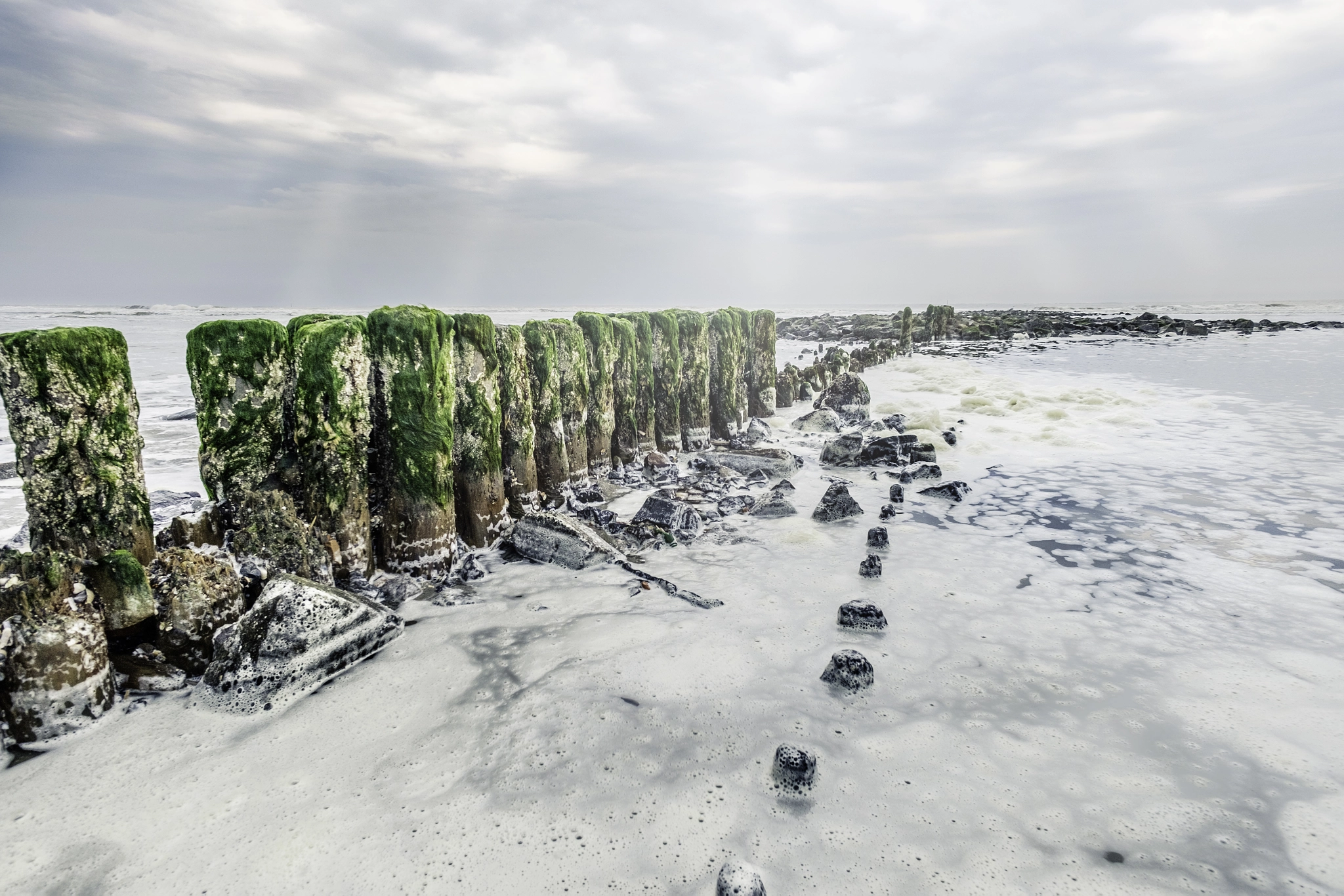 Fujifilm X-T10 + ZEISS Touit 12mm F2.8 sample photo. Sea ​​foam on the pale of the beach photography