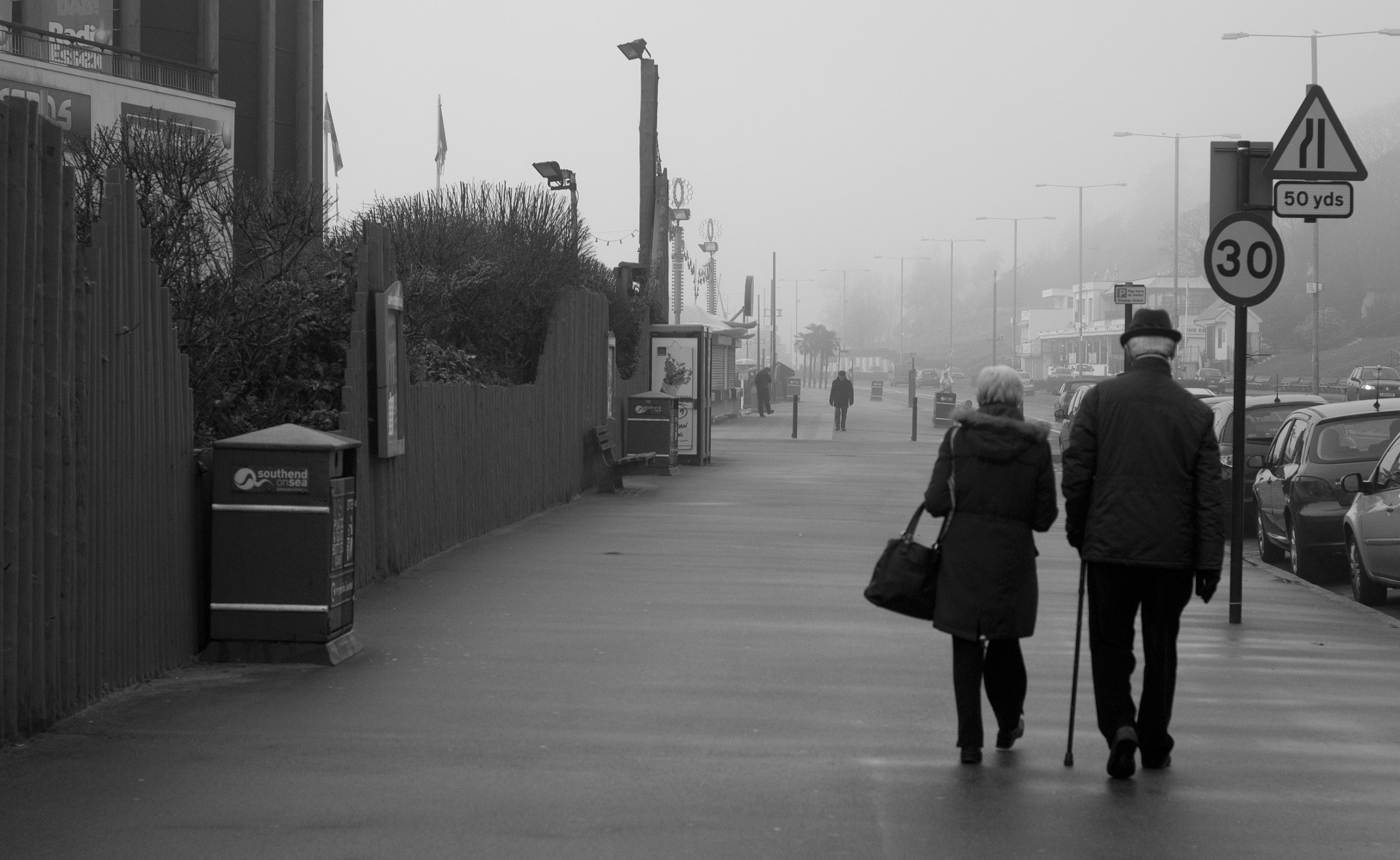 Nikon D3100 + AF Nikkor 50mm f/1.8 sample photo. Couple on the boardwalk photography