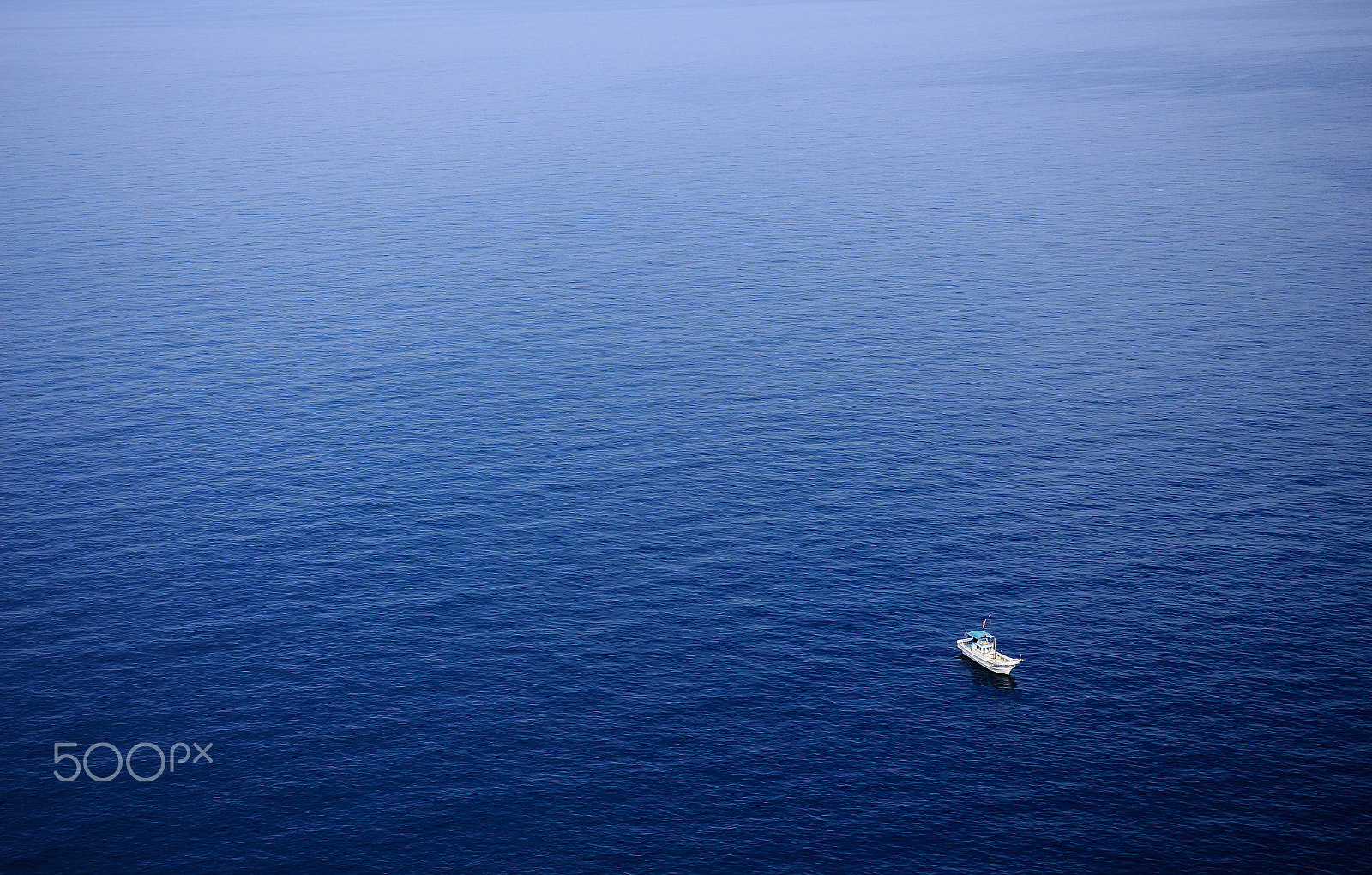 Sigma 18-35mm f/1.8 DC HSM sample photo. Boat on sea photography