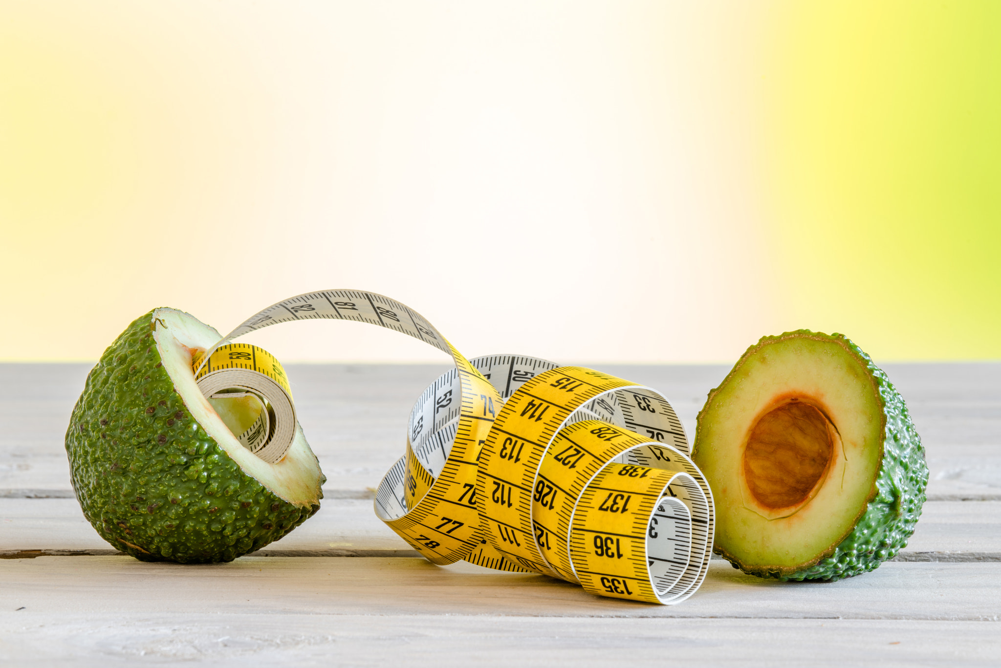 Sony a7R + Sony 70-400mm F4-5.6 G SSM II sample photo. Healthy avocado with measure tape photography