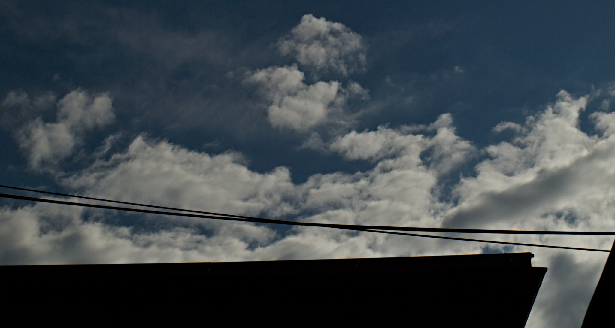 40.00 - 150.00 mm f/4.0 - 5.6 sample photo. A cloud above a roof... photography