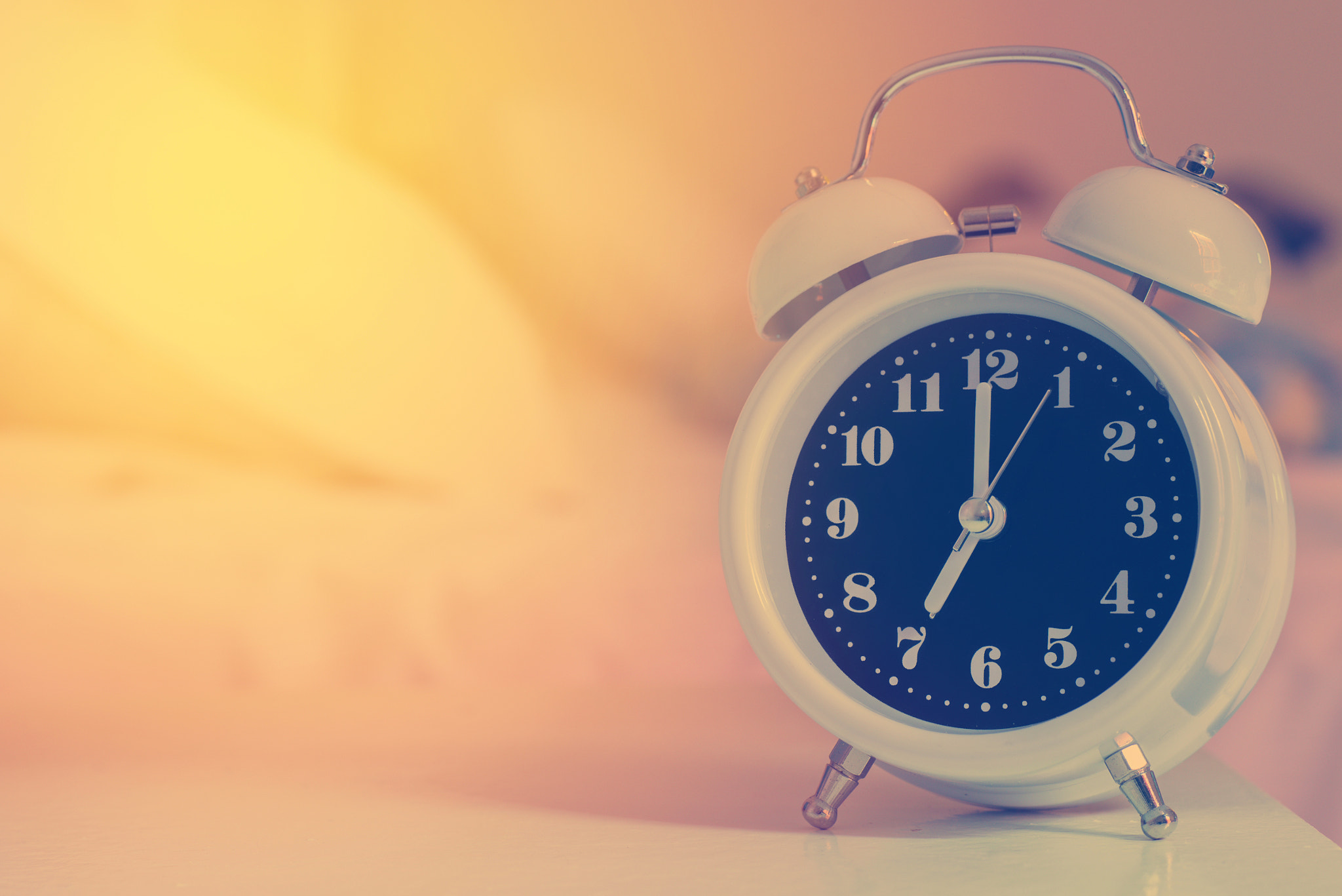 Nikon D600 + Sigma 70mm F2.8 EX DG Macro sample photo. Alarm clock on the bed in bedroom, retro style photography