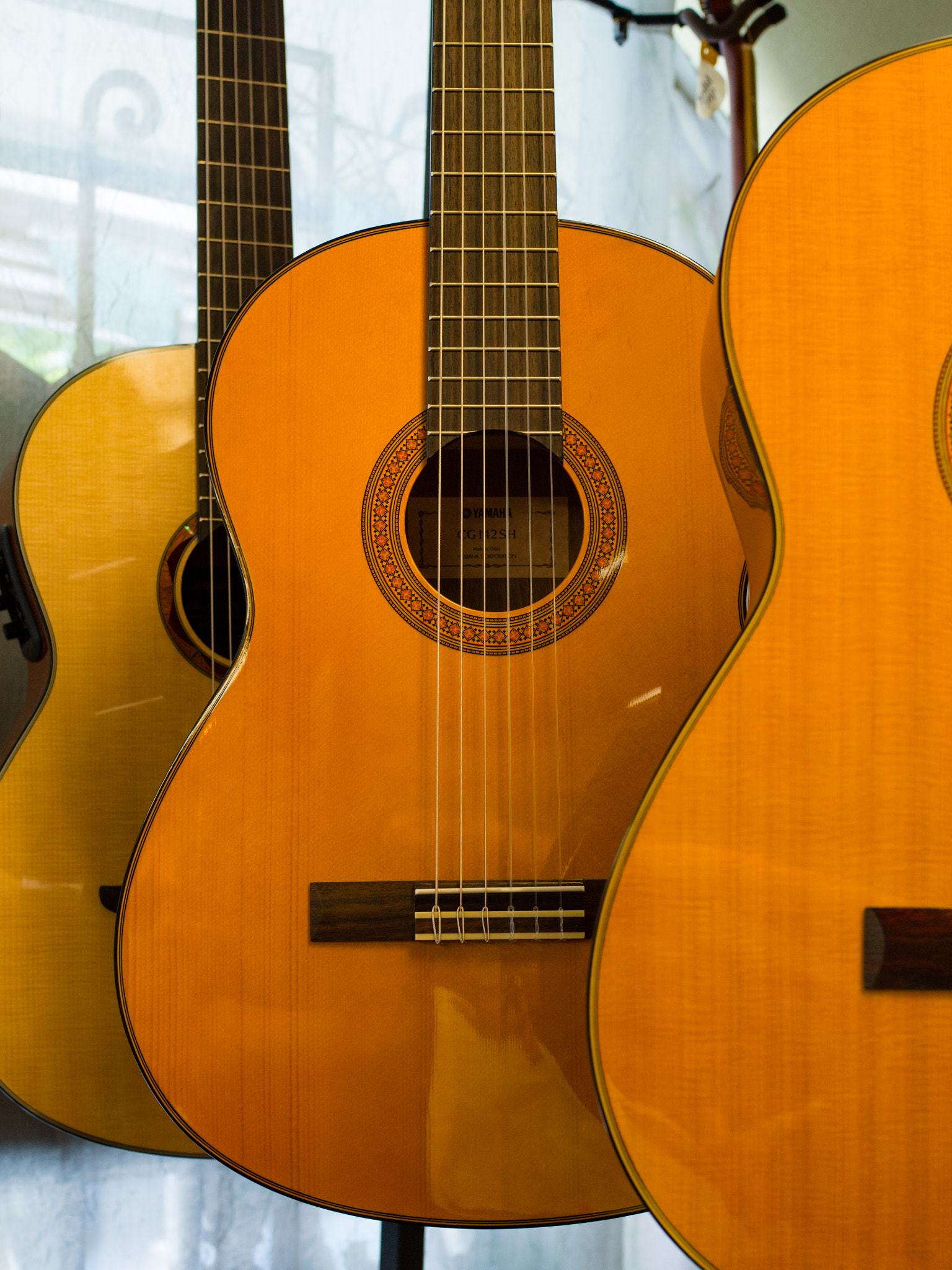 Olympus OM-D E-M10 + Olympus M.Zuiko Digital 25mm F1.8 sample photo. Guitars photography