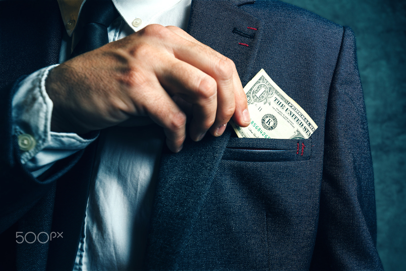 Tamron SP 15-30mm F2.8 Di VC USD sample photo. Businessman putting dollar banknotes money in his suit pocket photography
