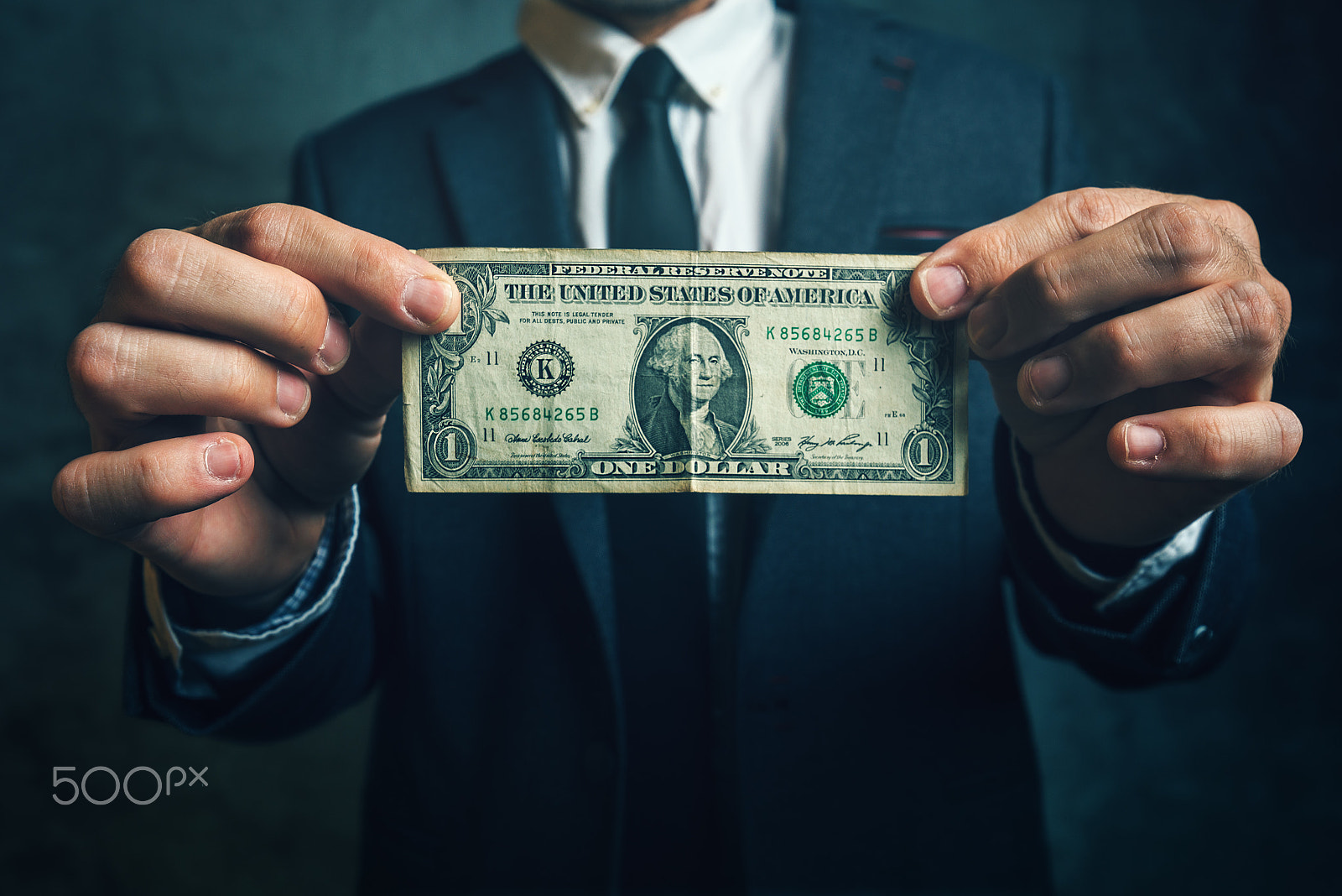 Tamron SP 15-30mm F2.8 Di VC USD sample photo. Businessman holding one usa dollar bill photography
