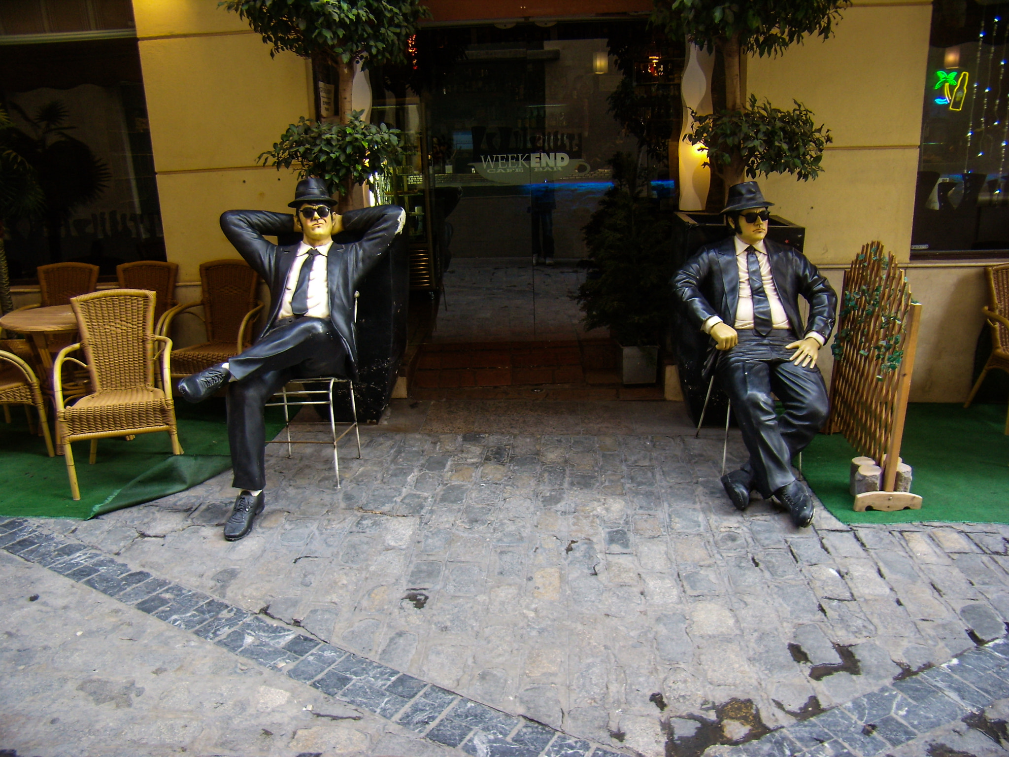 Olympus FE200 sample photo. Malaga: the blues brothers in front of a café photography