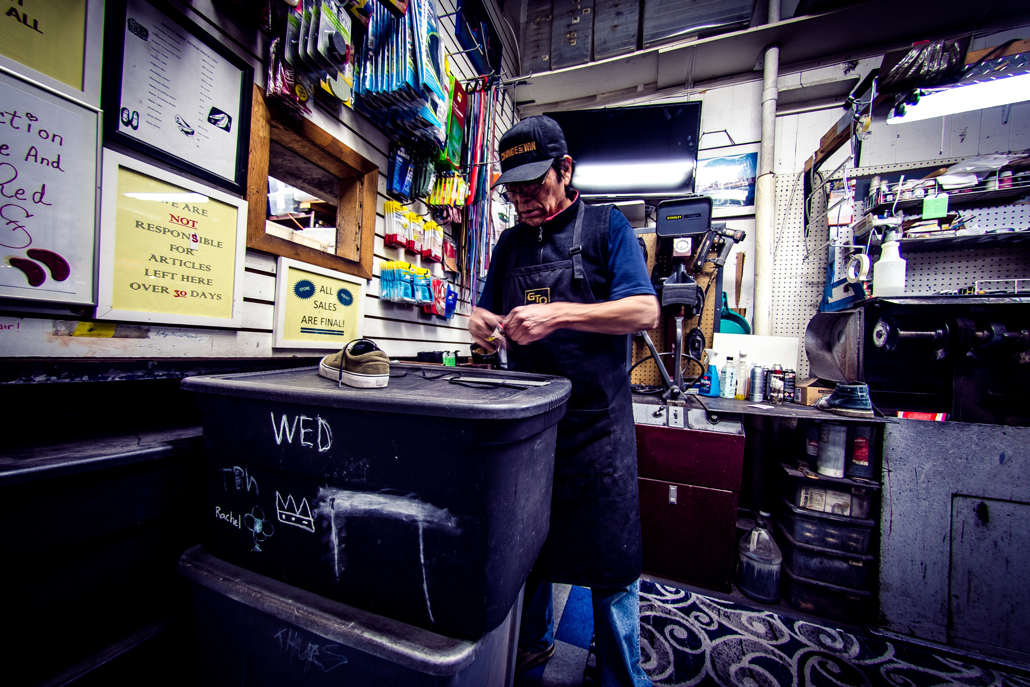 Nikon AF DX Fisheye-Nikkor 10.5mm F2.8G ED sample photo. Shoe repair - new york - usa photography
