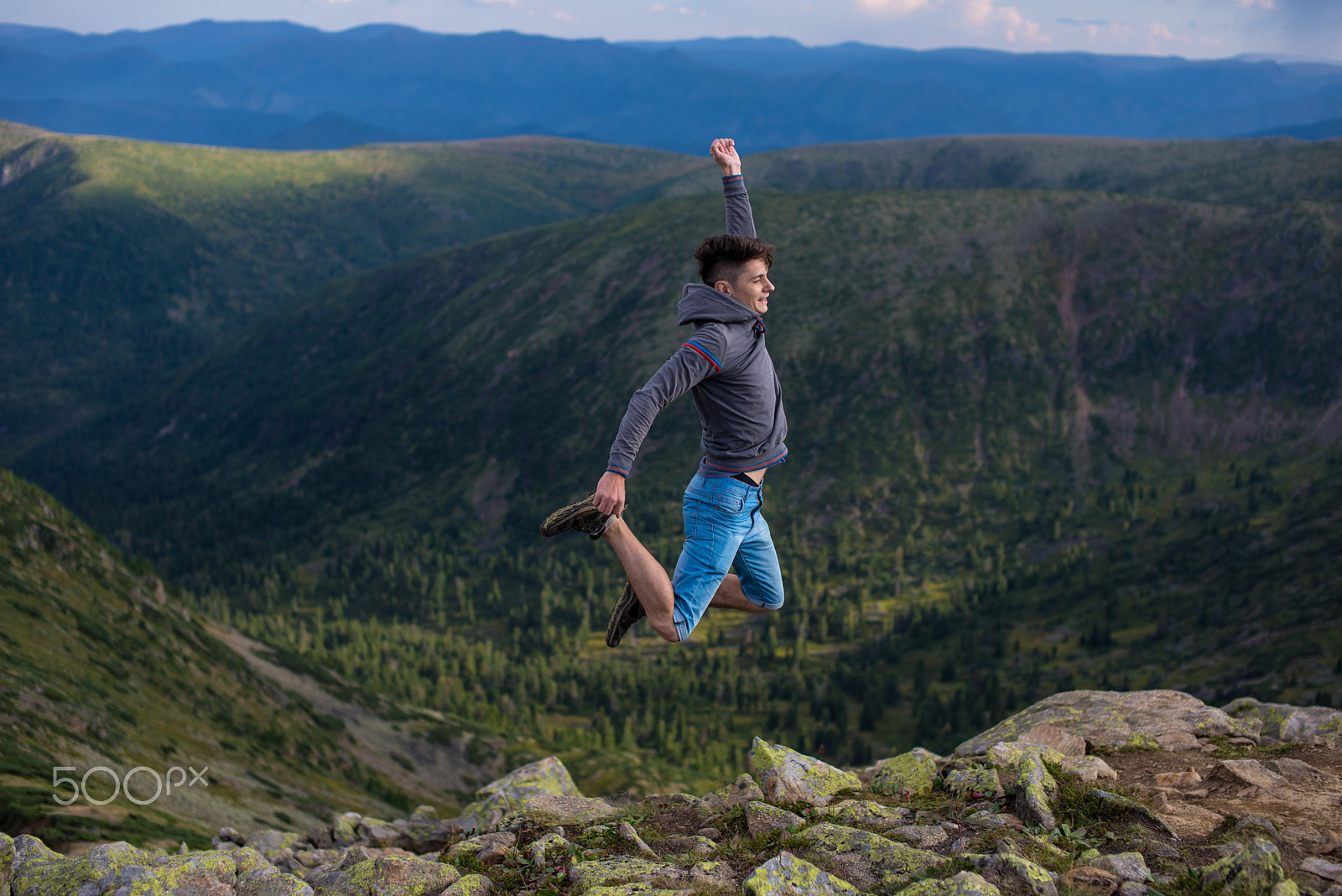 Nikon D600 + Sigma 50mm F1.4 EX DG HSM sample photo. Man jumping celebrating sucess with the view of a mountain photography