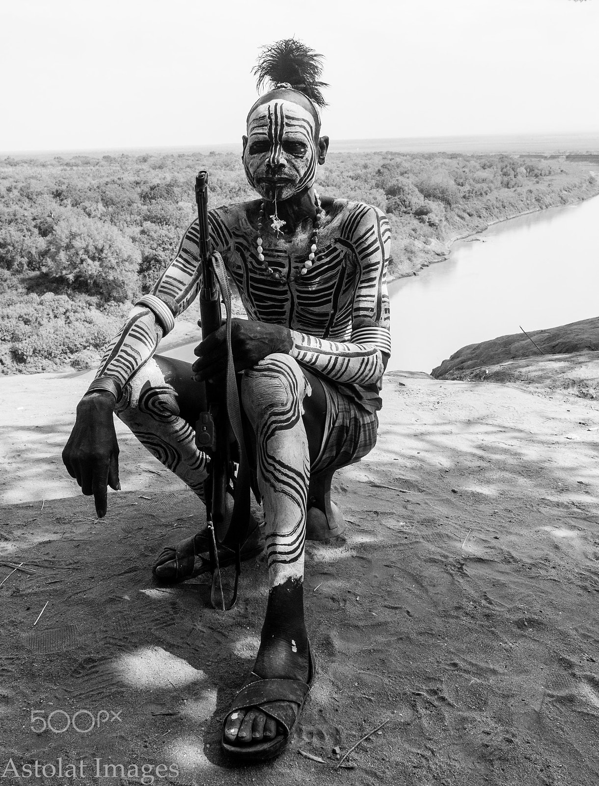 Sony a7R II + Sony Vario-Tessar T* E 16-70mm F4 ZA OSS sample photo. Karo warrior guarding cattle by omo river in ethiopia photography