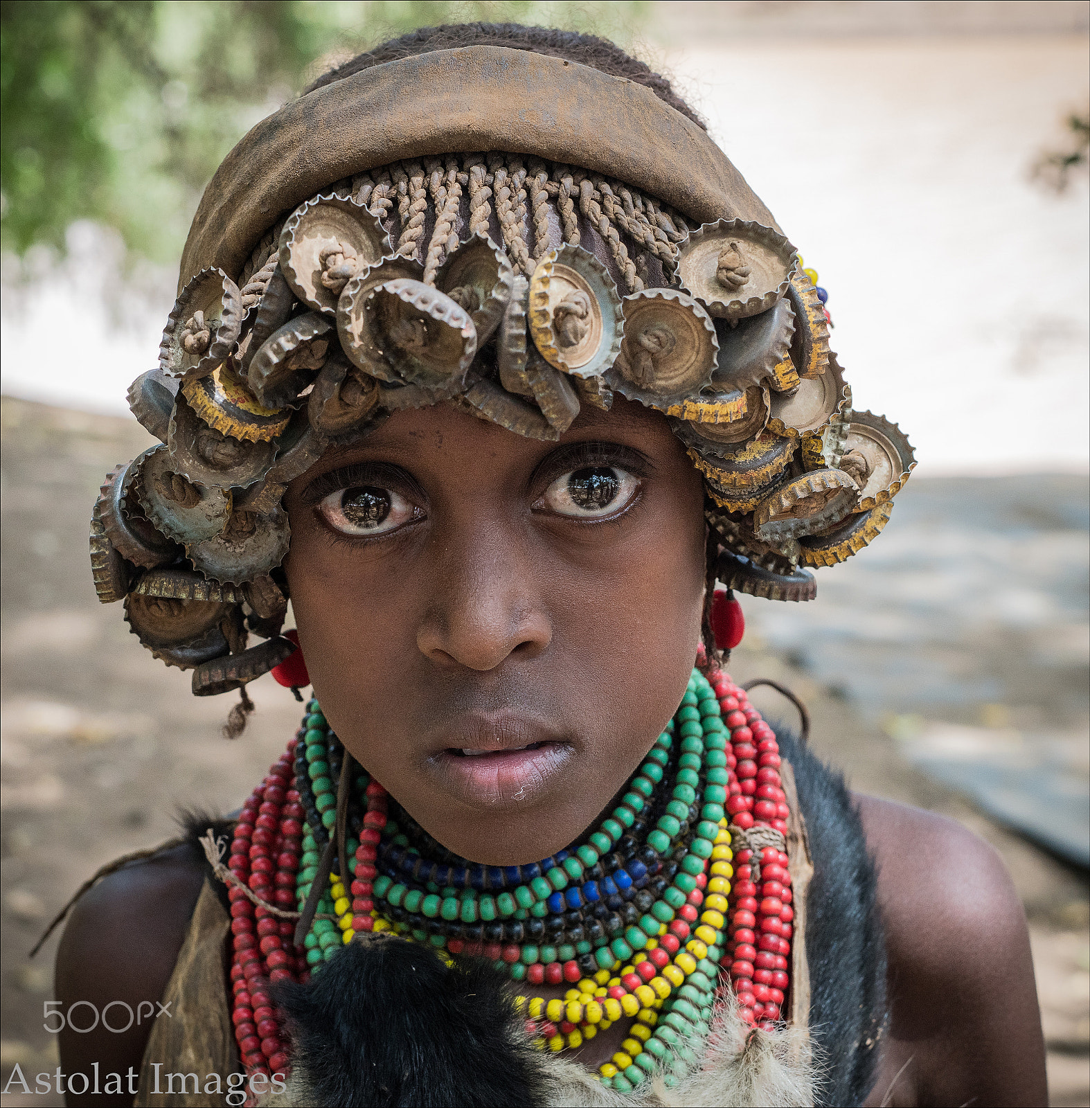 E 50mm F2 sample photo. Young dessenech girl with bottle cap headgear photography