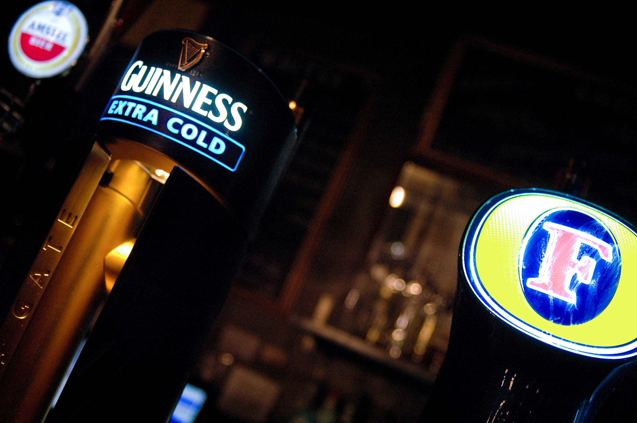 AF Zoom-Nikkor 28-80mm f/3.3-5.6G sample photo. Guinness and fosters on tap photography
