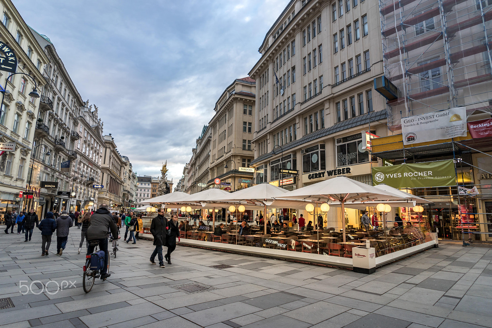 FE 21mm F2.8 sample photo. Vienna, austria- march 6, 2016: urban life and shop between side photography