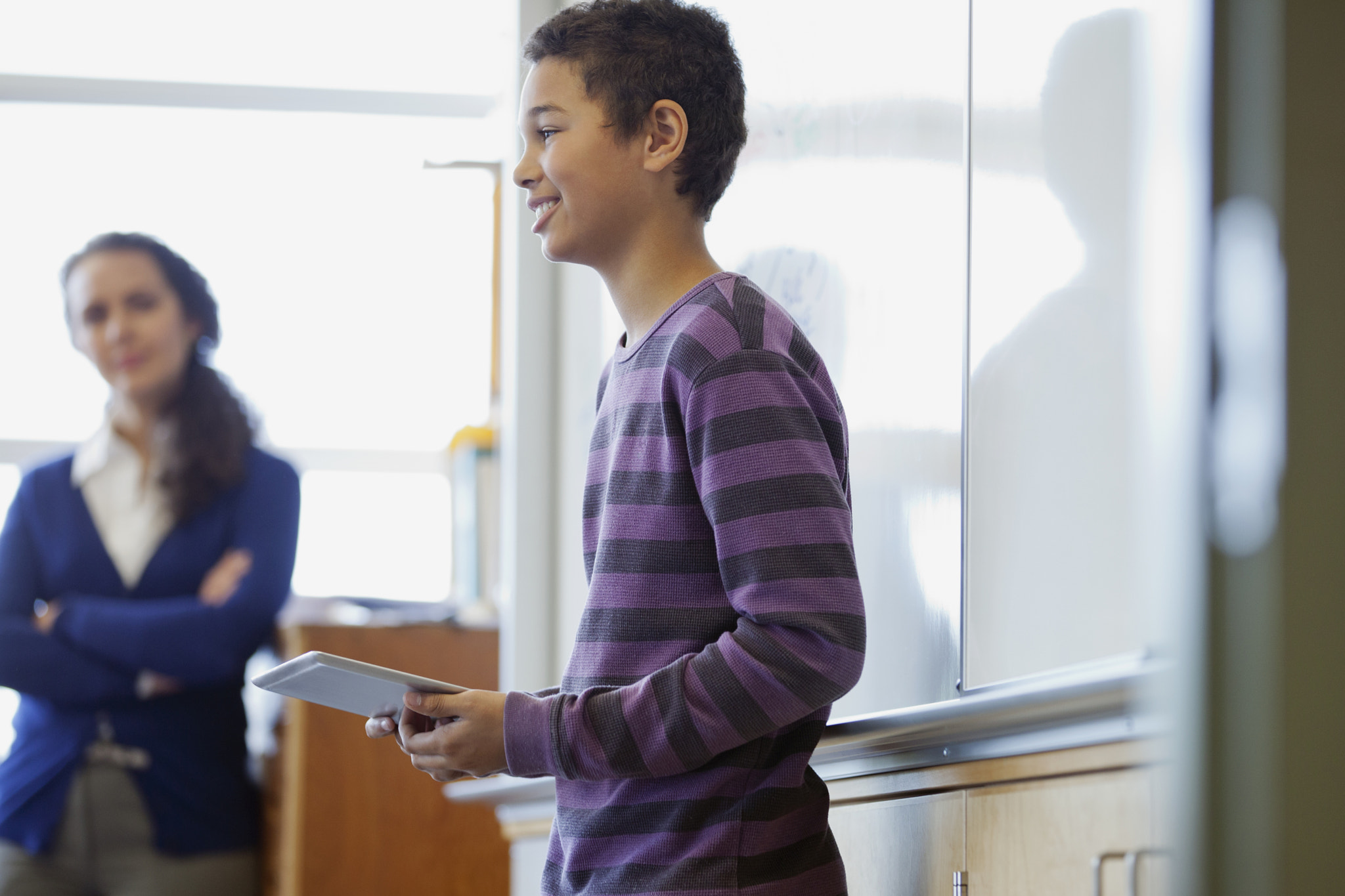 male middle school student presenting to class