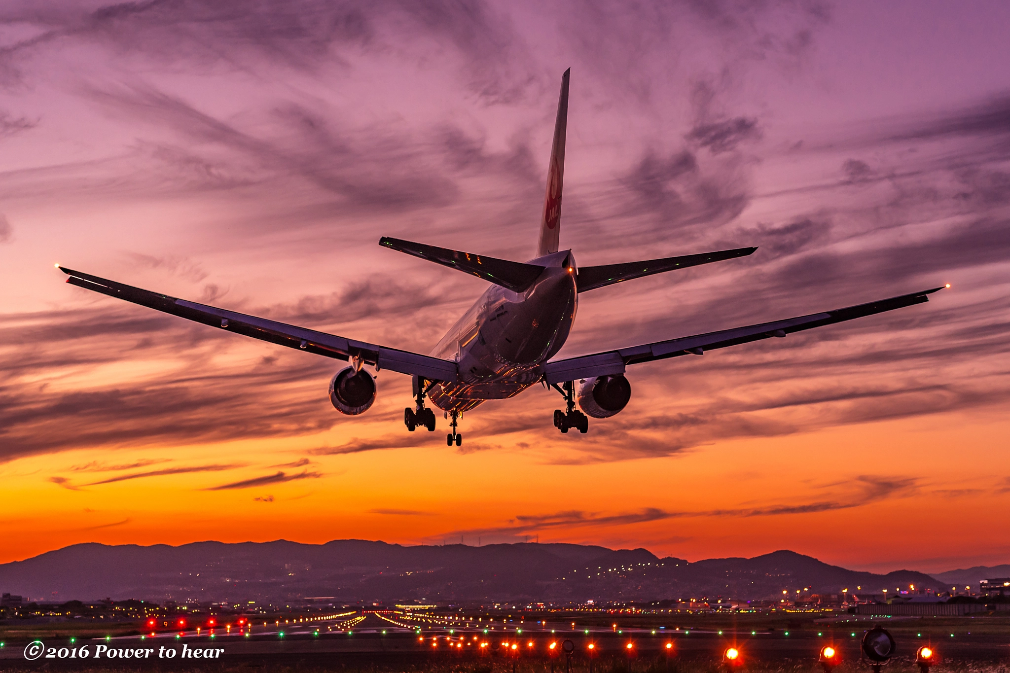 Nikon D5 + Sigma 50mm F1.4 DG HSM Art sample photo. B777 landing to a dark sunset photography