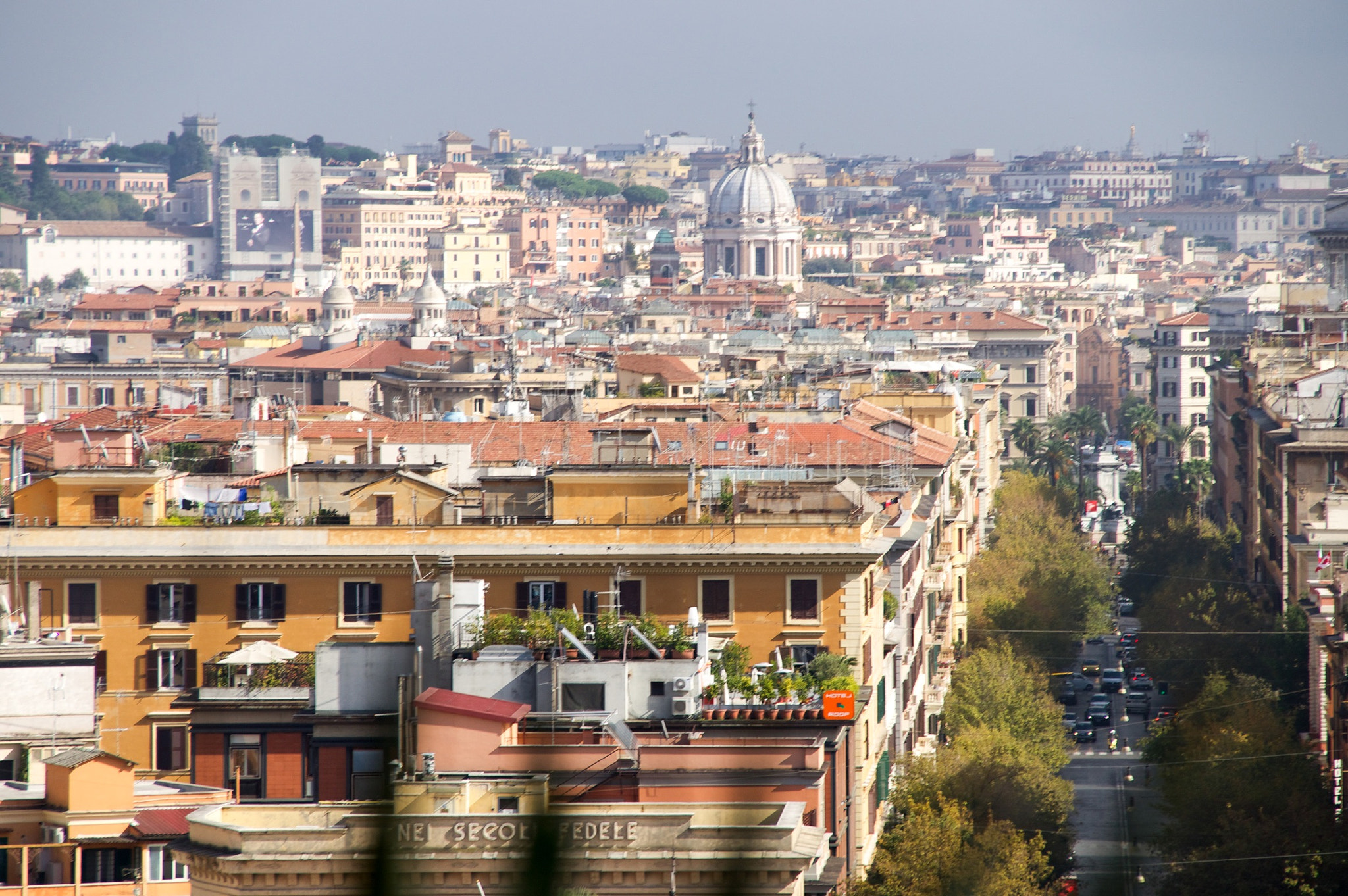 Sony DT 18-250mm F3.5-6.3 sample photo. View of italian city streets and buildings from a window view. photography