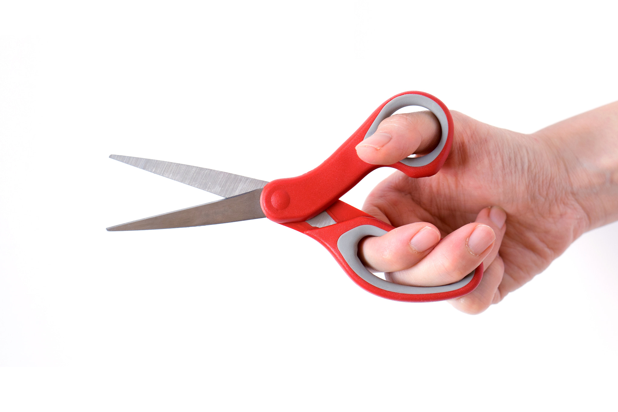 Sony a7 + E 50mm F1.8 OSS sample photo. Female hand holding scissors, isolated on white background photography