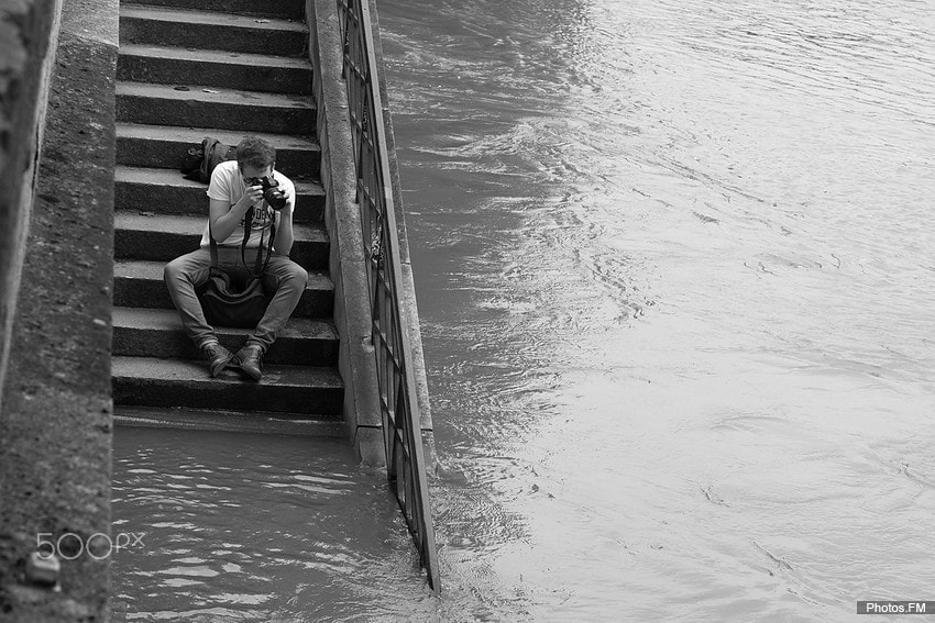 Canon EOS 50D + Canon EF 50mm F1.4 USM sample photo. A photographer capture the seine flood photography