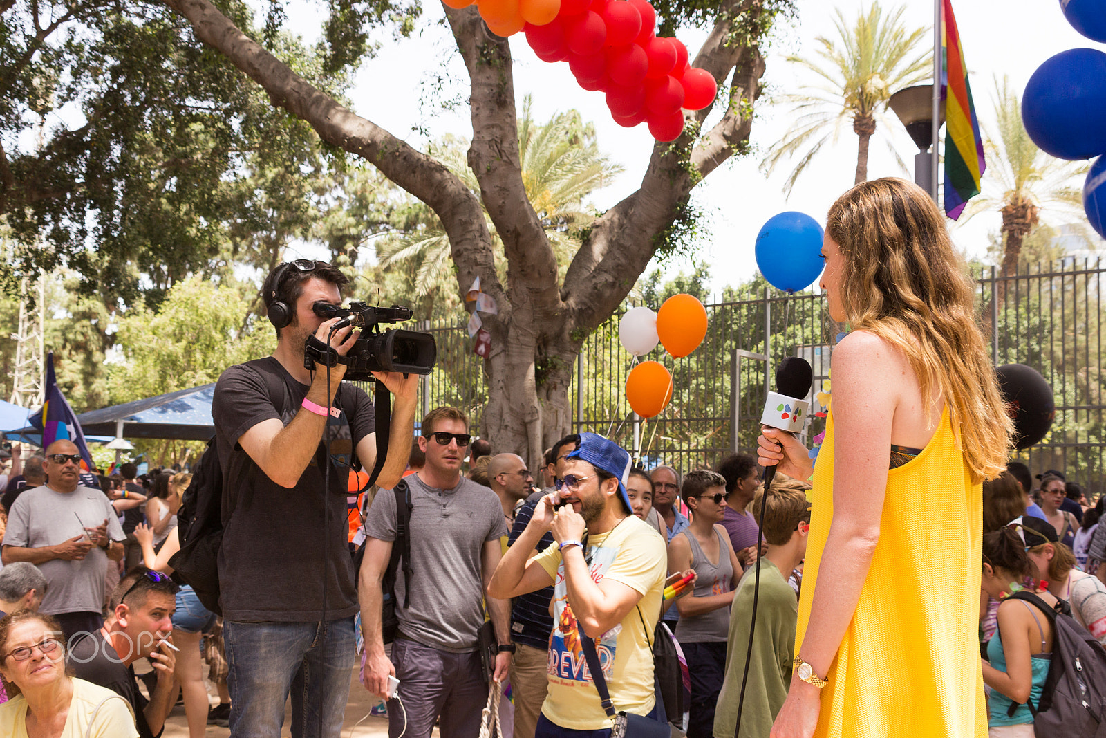 Canon EF 75-300mm F4.0-5.6 IS USM sample photo. Representatives of tv are reporting from pride parade photography