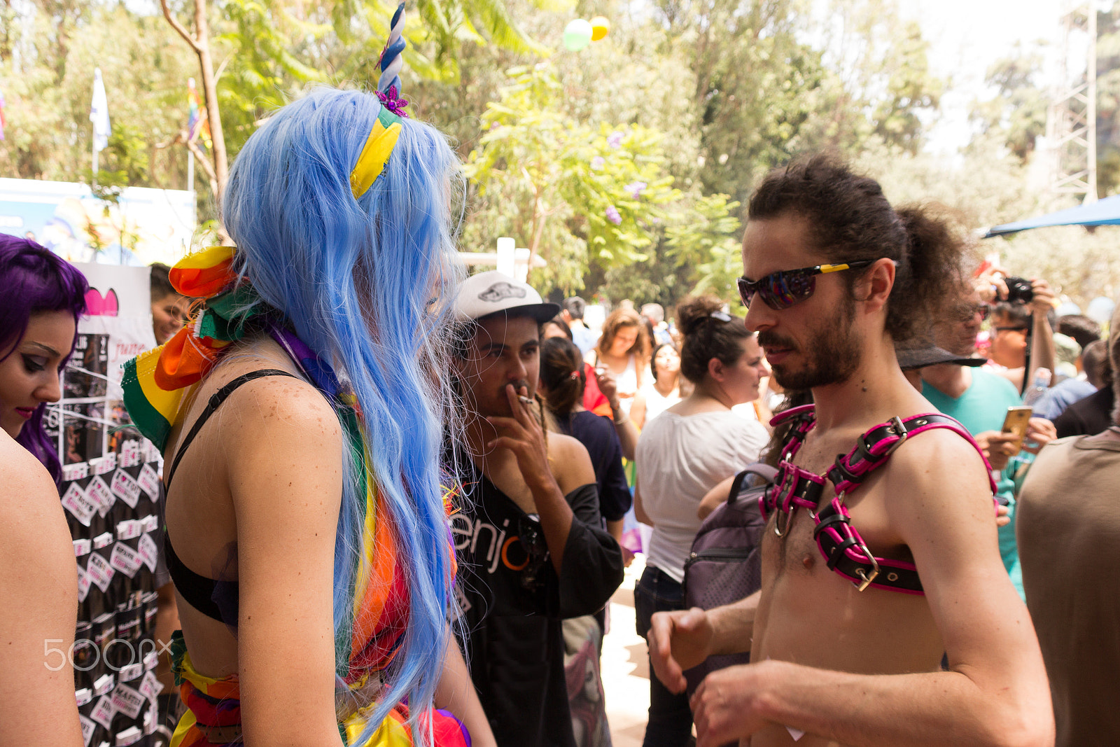 Canon EF 75-300mm F4.0-5.6 IS USM sample photo. Member of the pride parade talk to each other photography