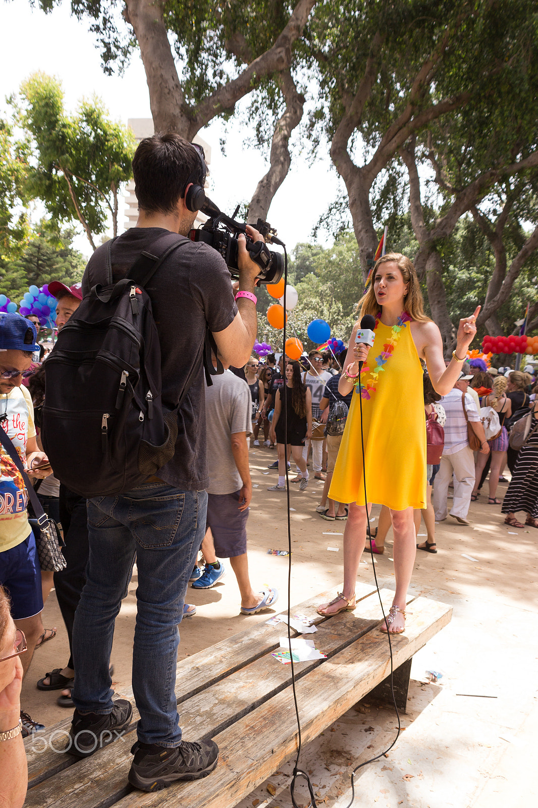 Canon EF 75-300mm F4.0-5.6 IS USM sample photo. Representatives of tv are reporting from  pride parade photography