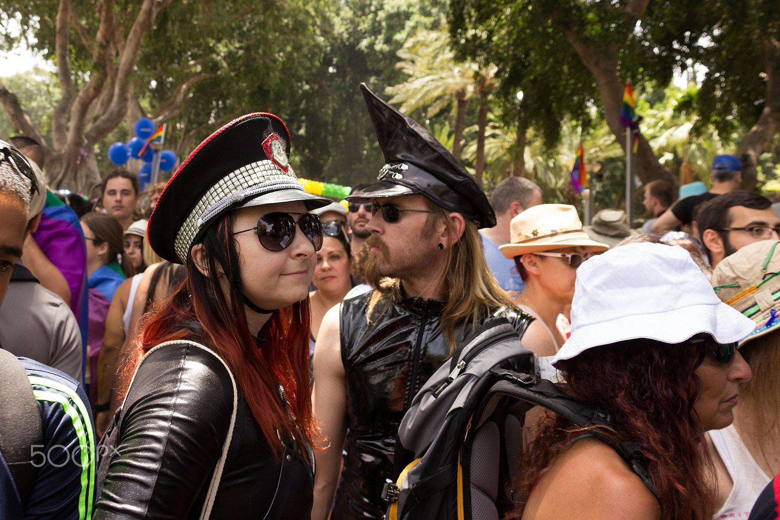 Canon EF 75-300mm F4.0-5.6 IS USM sample photo. Members of  pride parade surrounded by other people photography