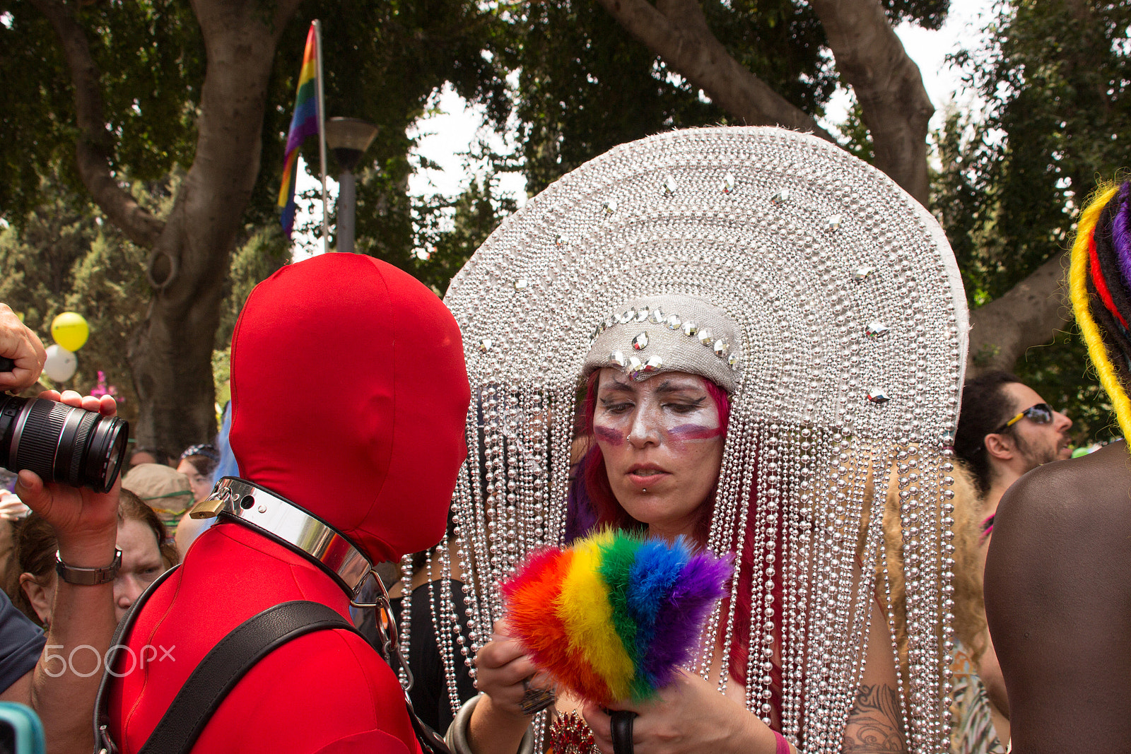 Canon EF 75-300mm F4.0-5.6 IS USM sample photo. Members of pride parade surrounded by other people photography