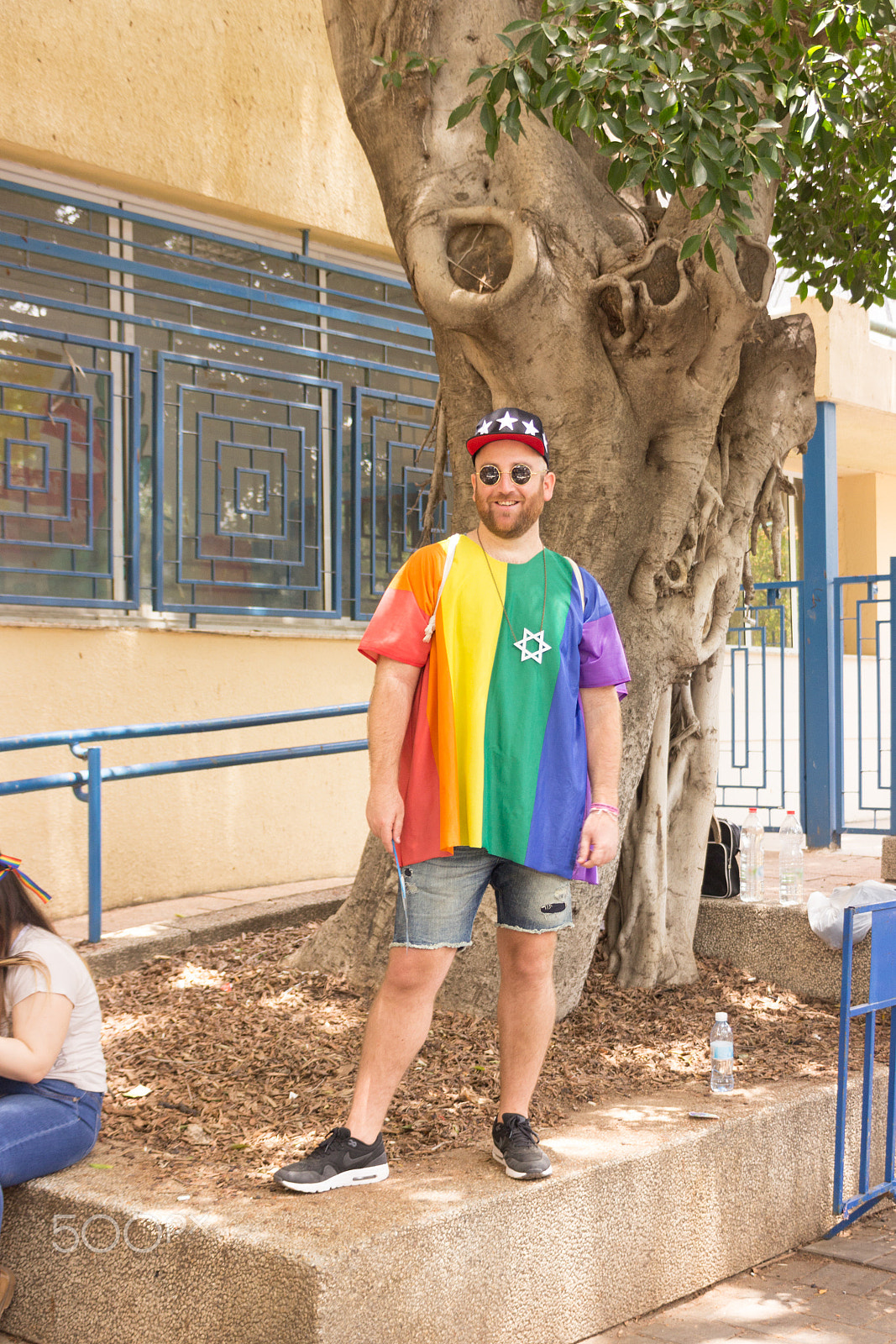 Canon EF 75-300mm F4.0-5.6 IS USM sample photo. Members of pride parade poses for the photographer photography