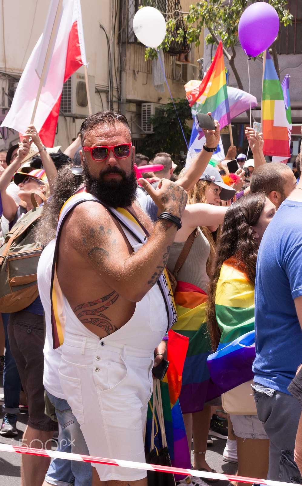 Canon EF 75-300mm F4.0-5.6 IS USM sample photo. Members of pride parade poses for the photographer photography