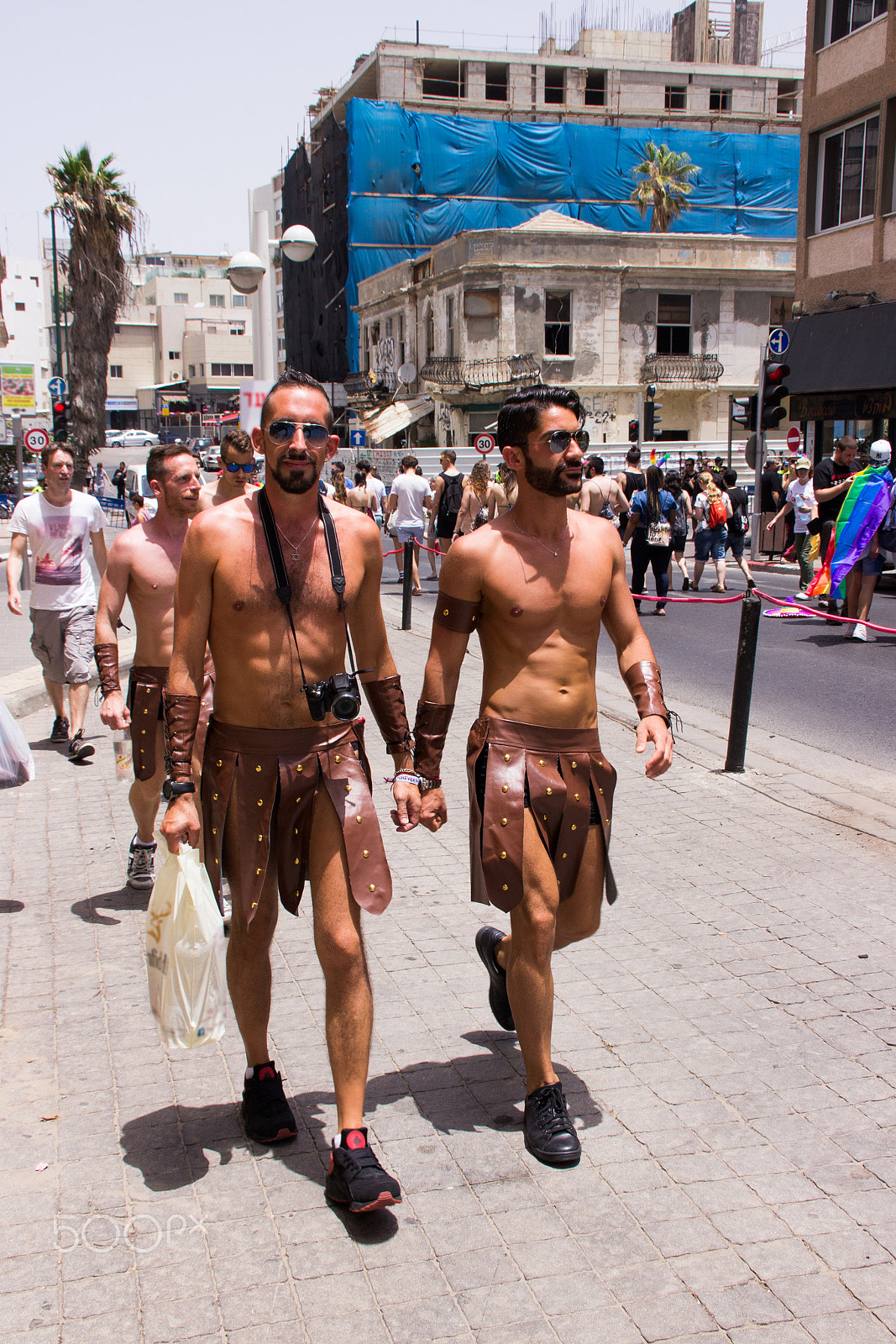 Canon EF 75-300mm F4.0-5.6 IS USM sample photo. Members of pride parade surrounded by other people photography