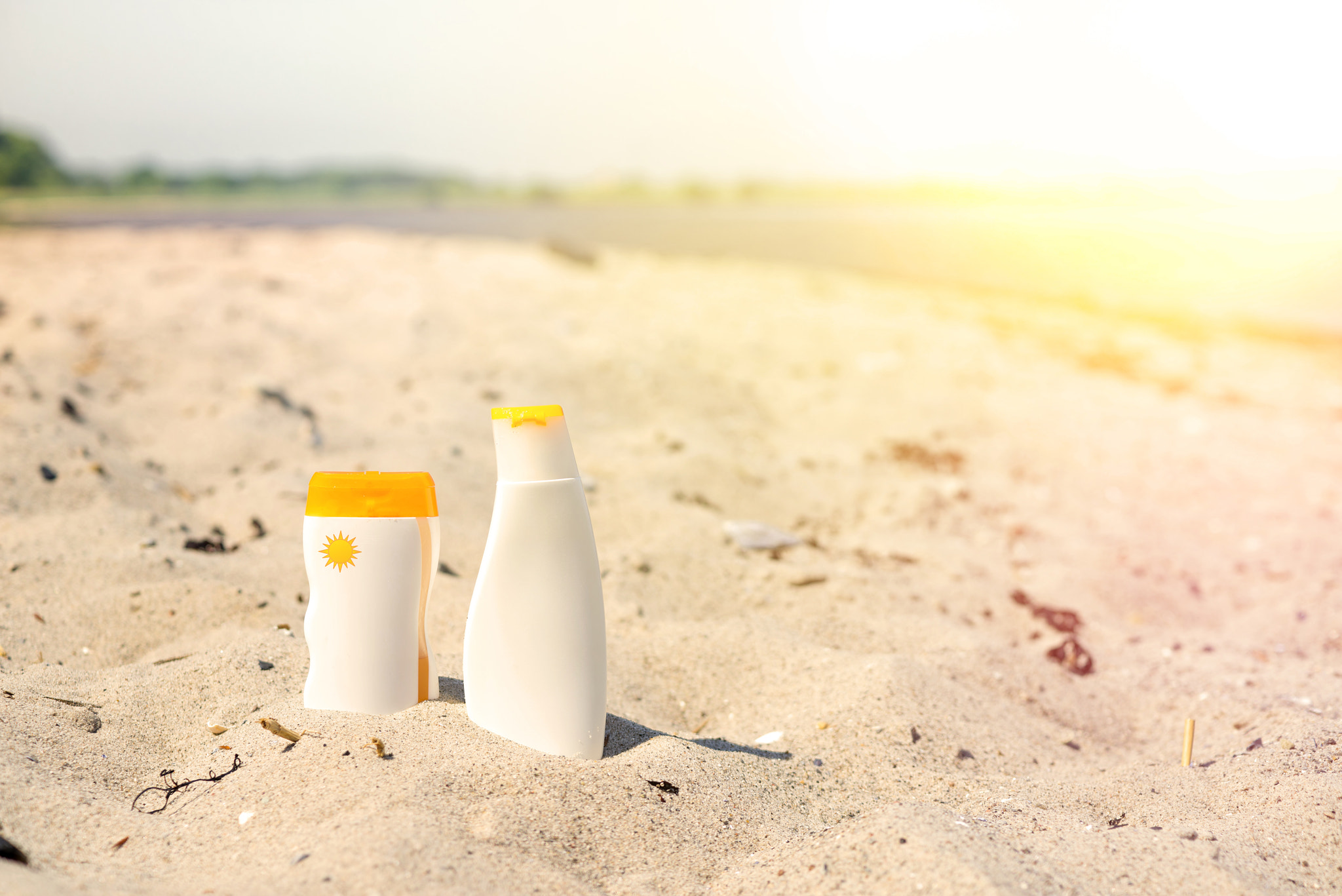 Sony a7R + Sony 50mm F1.4 sample photo. Sunlotion in the sand on a beach photography