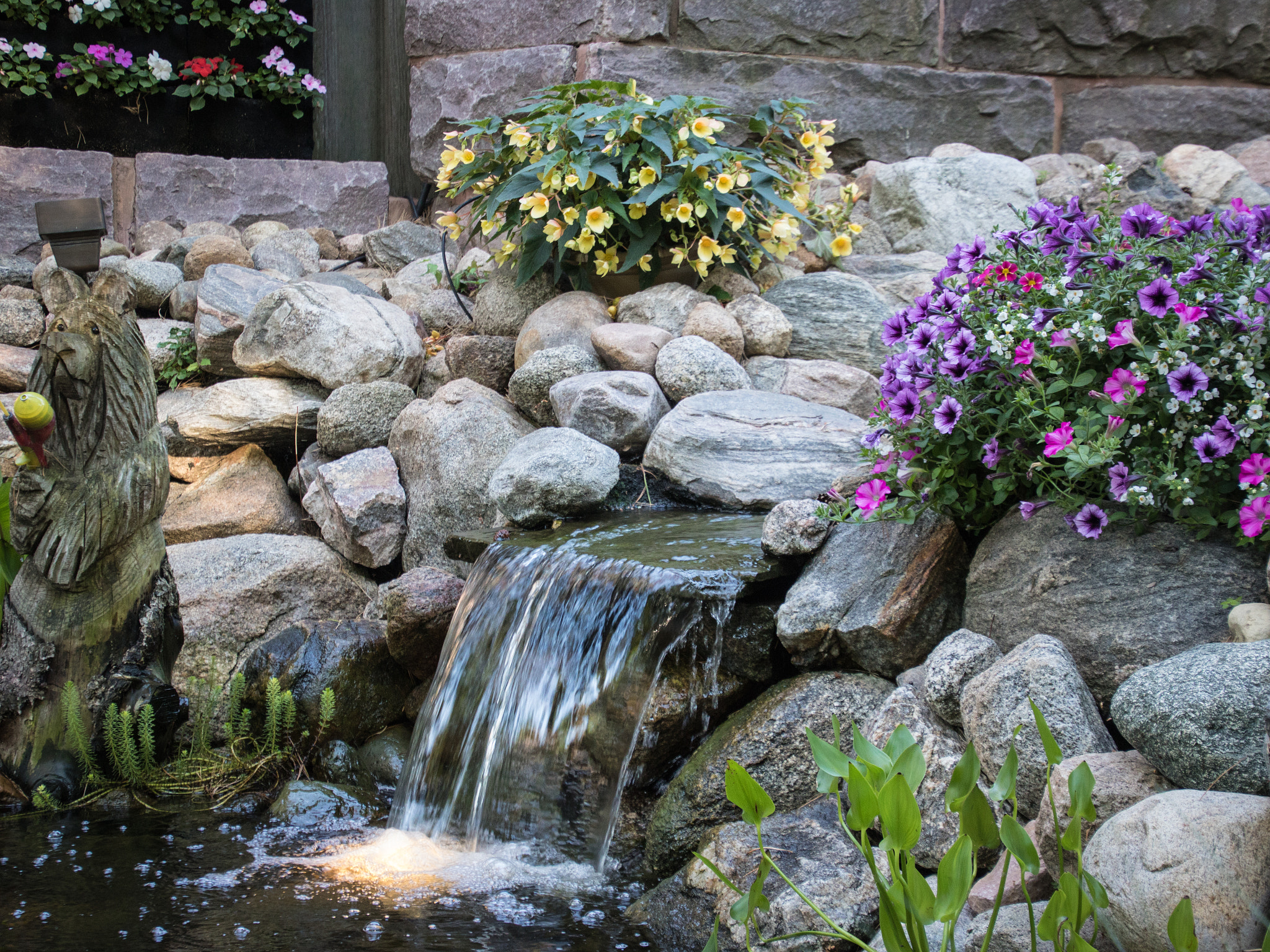 Canon EOS 760D (EOS Rebel T6s / EOS 8000D) sample photo. Waterfall in garden with bear statue photography