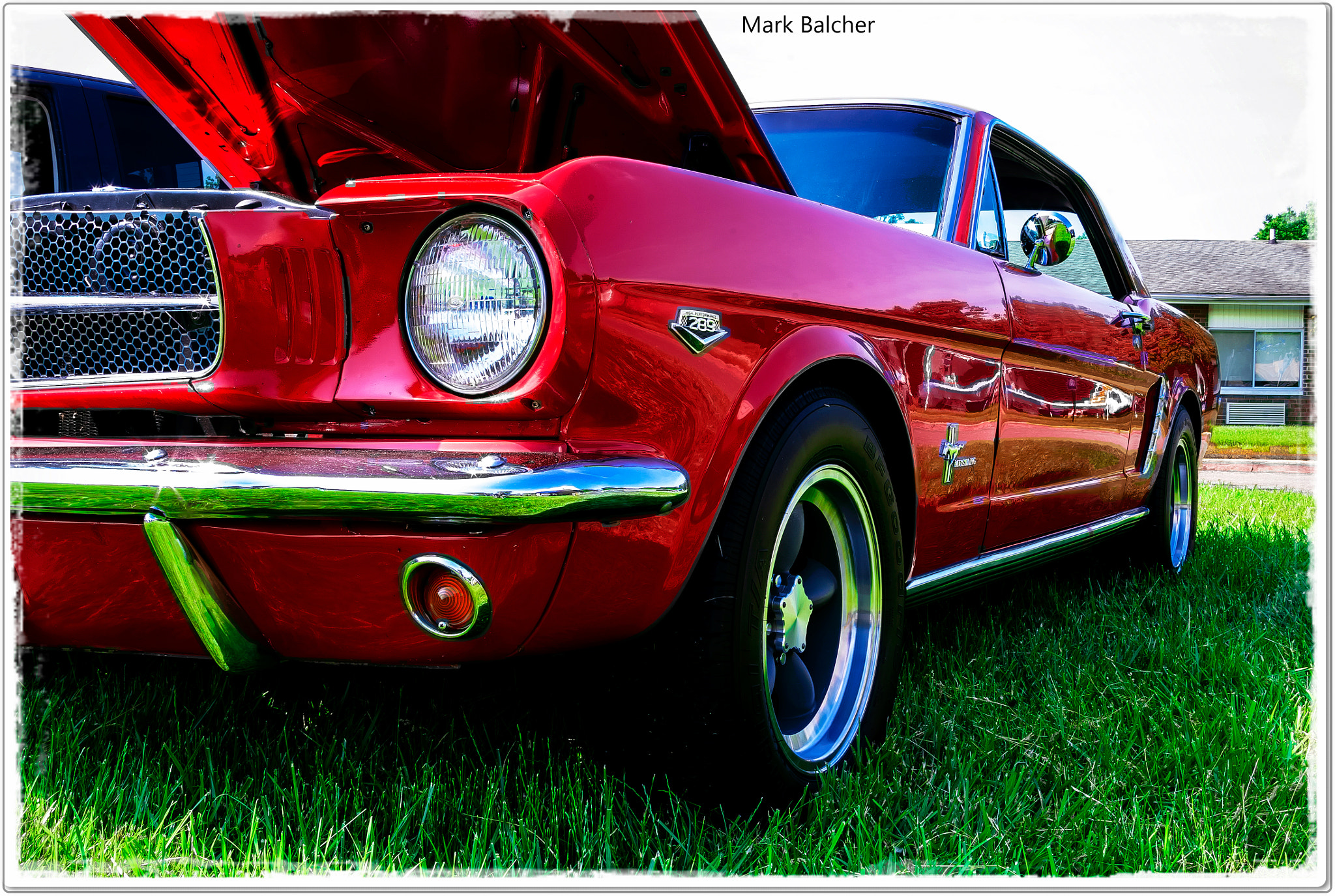 Pentax K-x + Pentax smc DA 18-55mm F3.5-5.6 AL sample photo. A beautiful bright red '65 ford mustang. pristine. photography