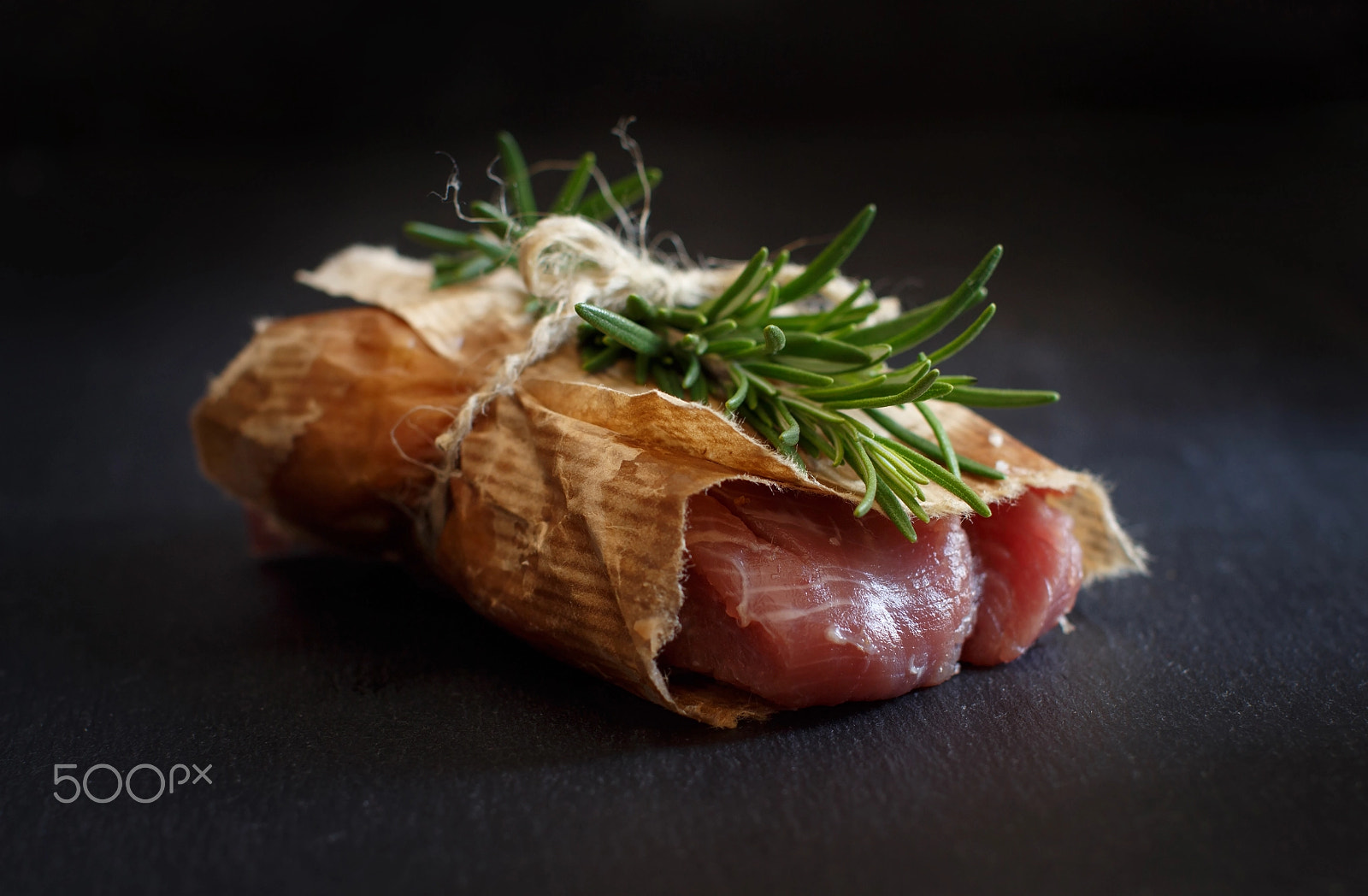 Canon EOS 650D (EOS Rebel T4i / EOS Kiss X6i) + Canon EF 50mm F1.2L USM sample photo. Slice of raw turkey steak with rosemary photography