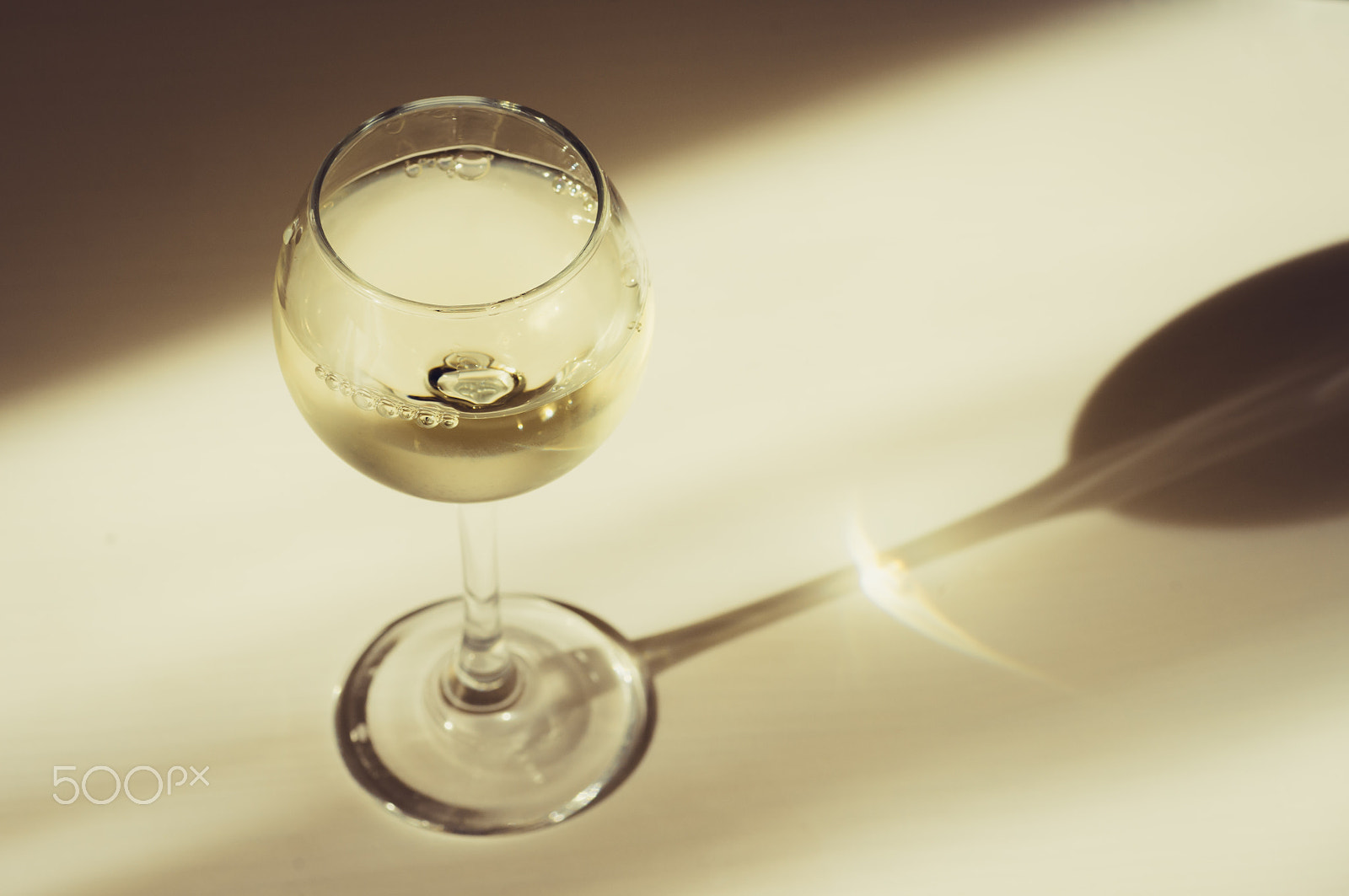 Pentax K-r + Tamron SP AF 90mm F2.8 Di Macro sample photo. Wineglass of white wine in the shadows and rays photography
