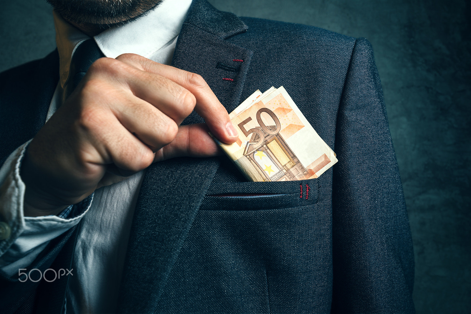 Tamron SP 15-30mm F2.8 Di VC USD sample photo. Businessman putting euro banknotes money in his suit pocket photography