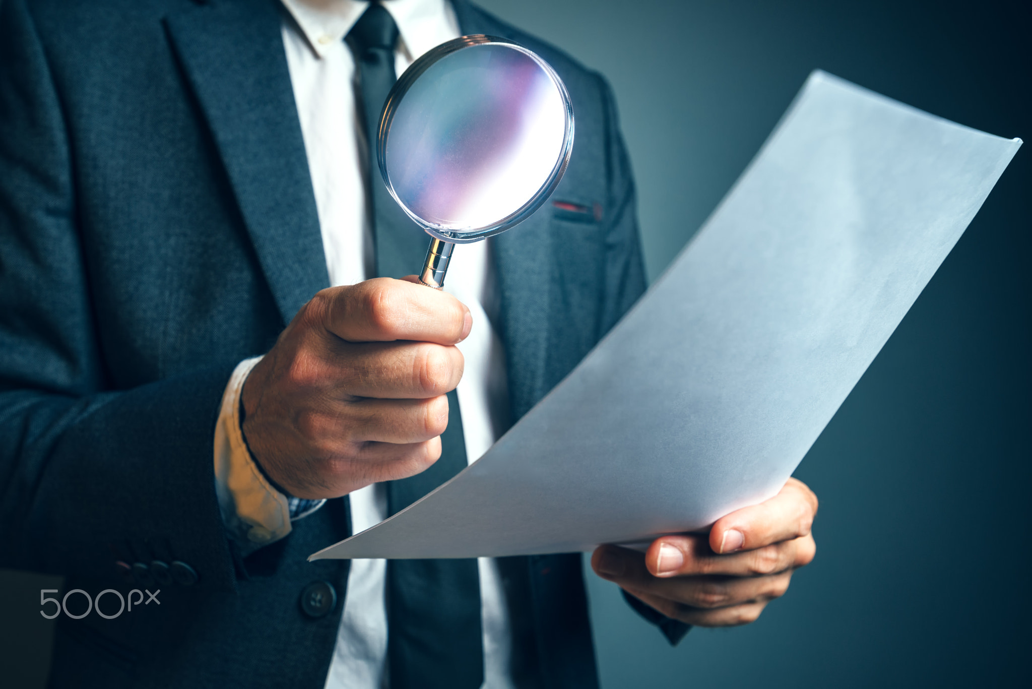 Lawyer reading legal contract agreement disclaimer with magnifyi