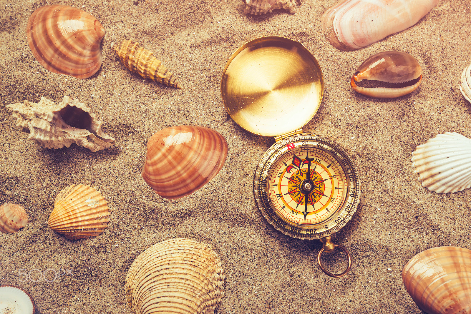 Tamron SP 15-30mm F2.8 Di VC USD sample photo. Top view of vintage compass in beach sand photography