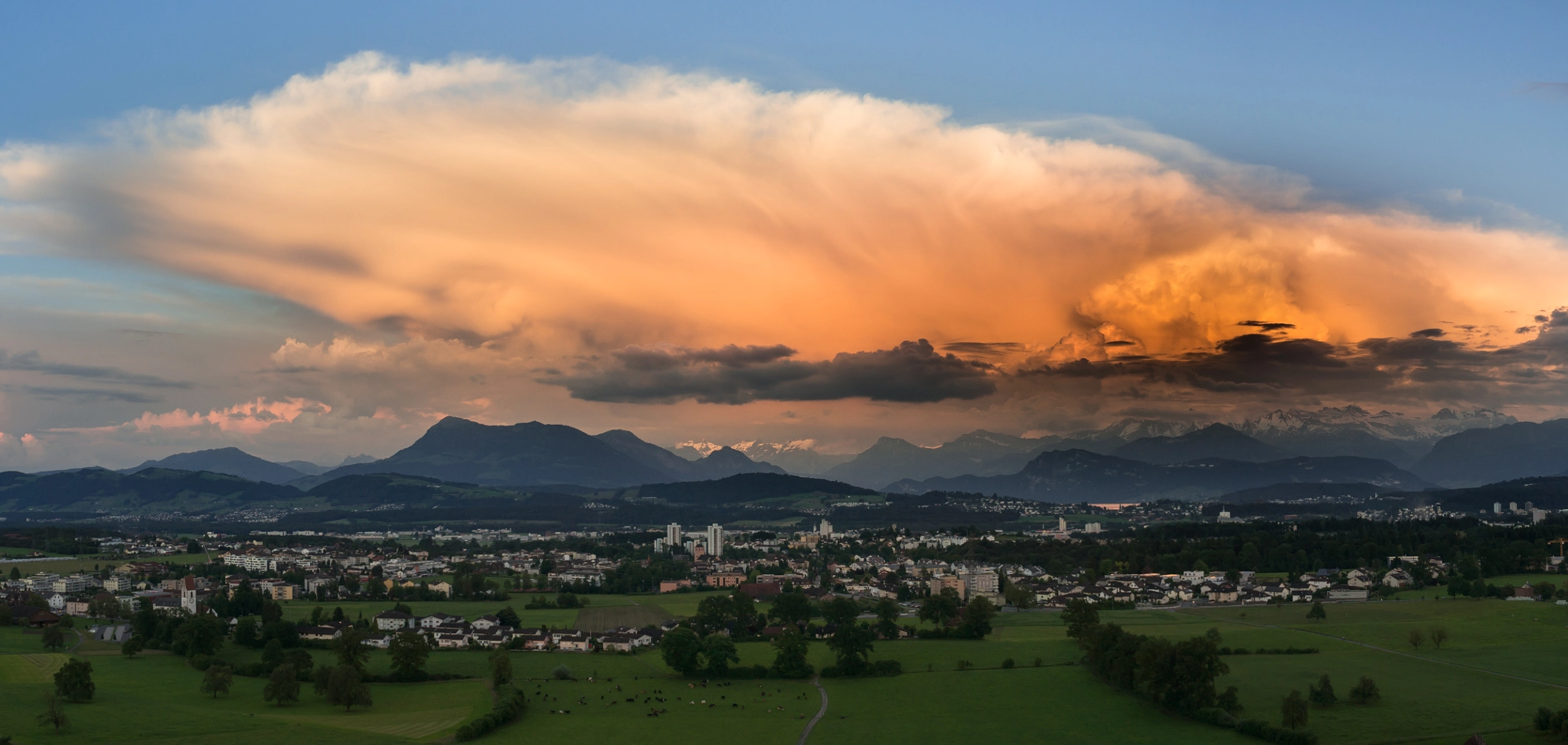 Sony Alpha NEX-5T + Sony E 16mm F2.8 sample photo. Massive thundery cluster above the swiss alps photography