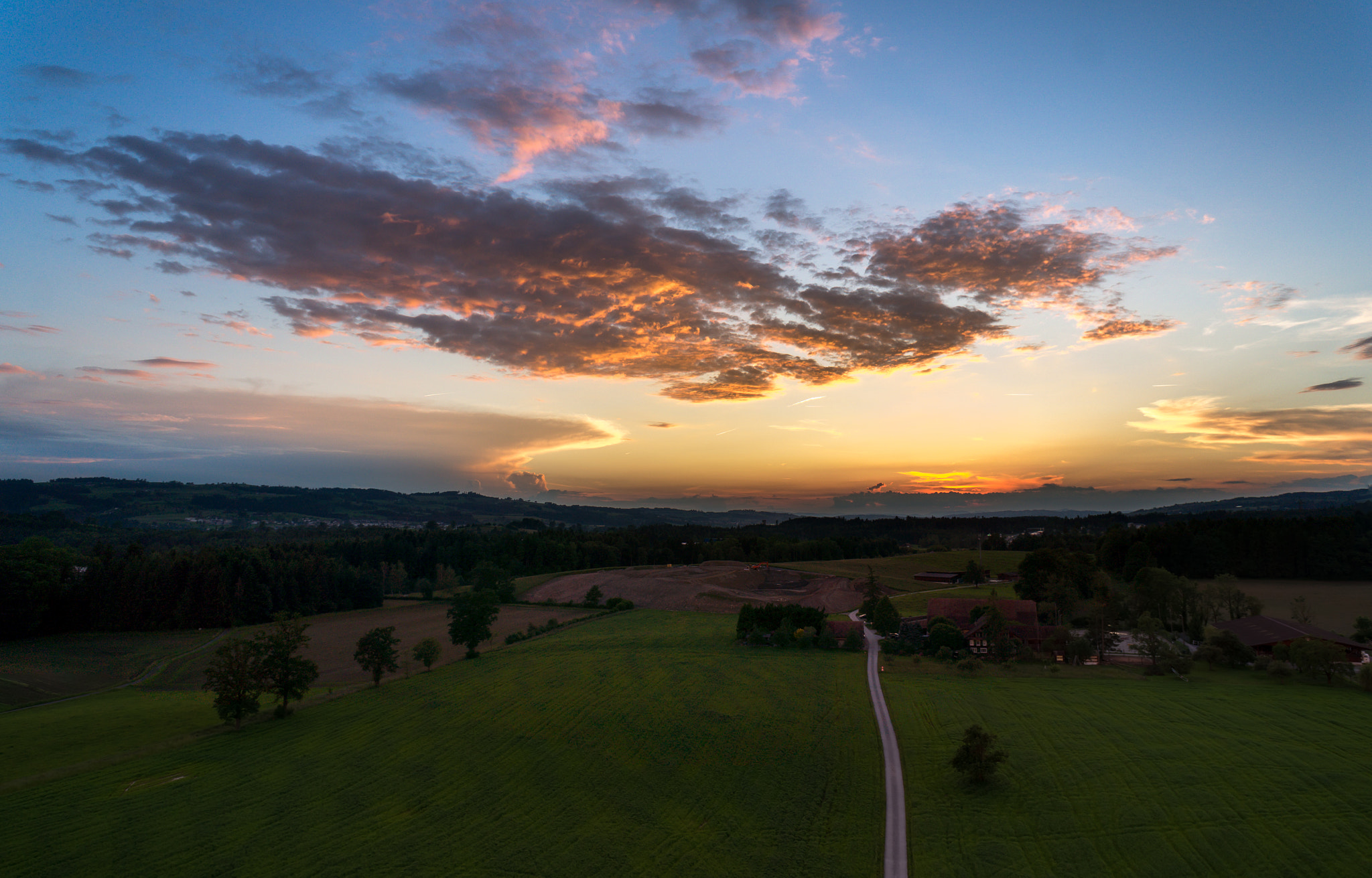 Sony Alpha NEX-5T + Sony E 16mm F2.8 sample photo. Colorful sunset after thunderstorm photography
