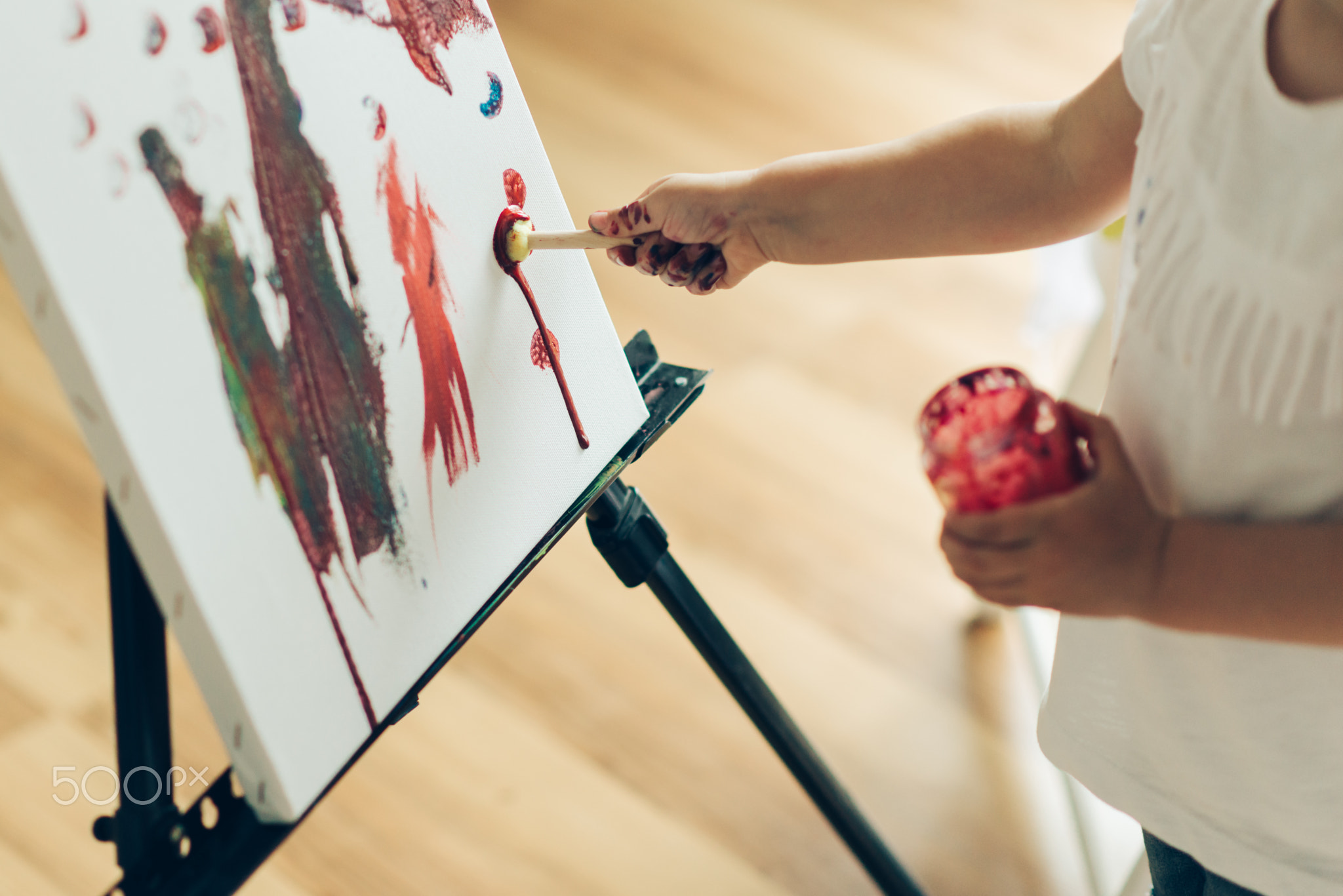 Cut girl painting in at her  home