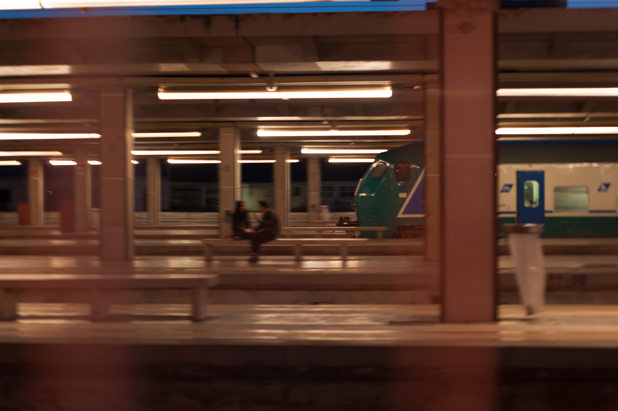 Sony Alpha DSLR-A390 + Minolta AF 50mm F1.7 sample photo. Couple in a desert train station photography