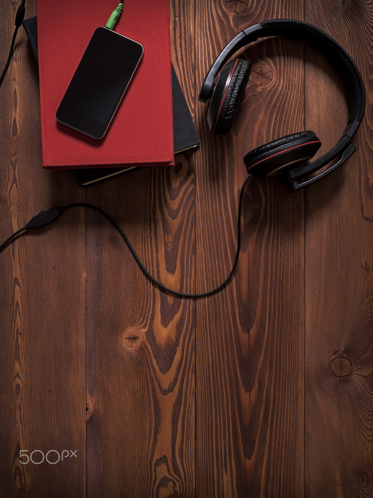 Olympus OM-D E-M1 + OLYMPUS 14-54mm Lens sample photo. Pile of books with headphones photography