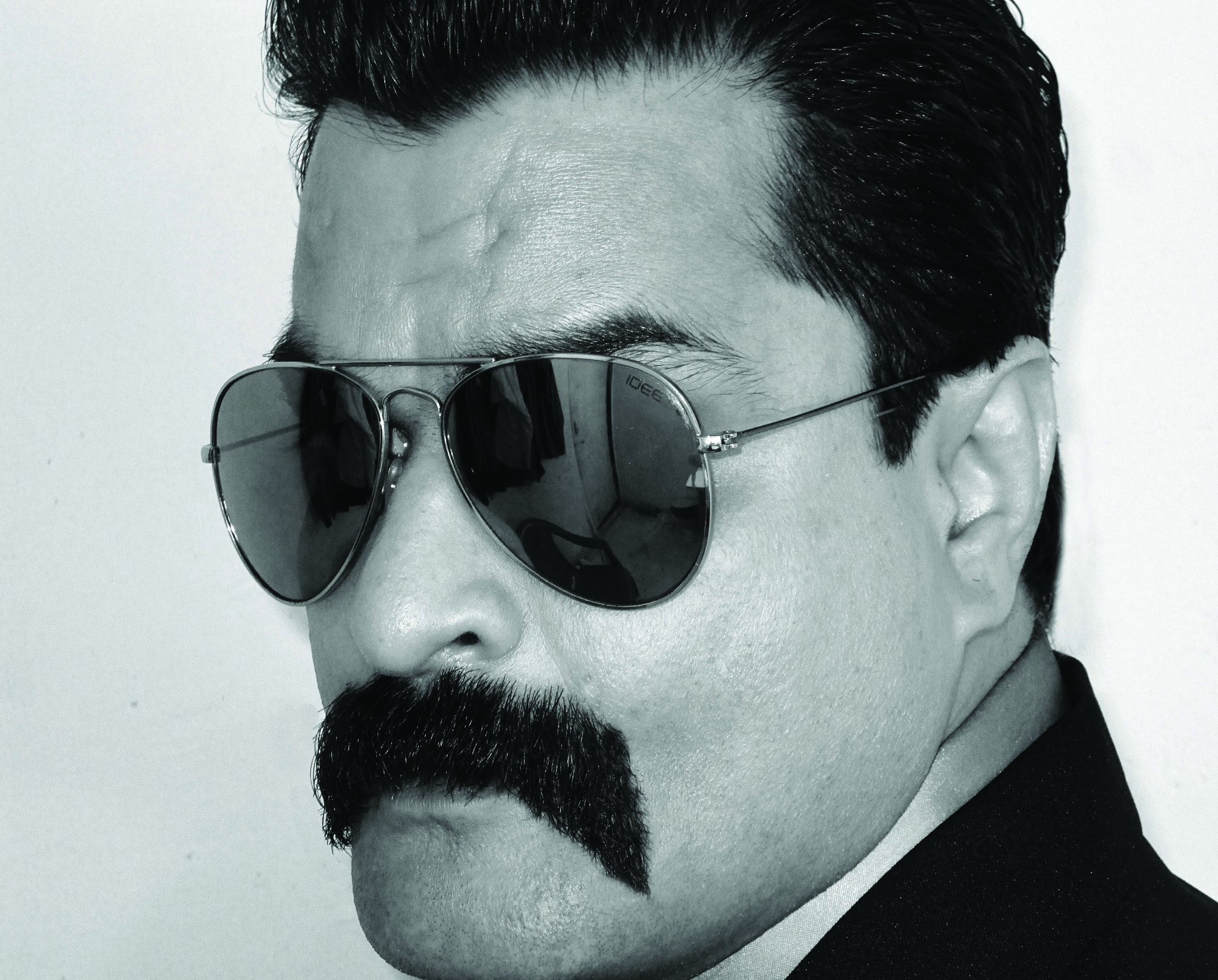 Canon PowerShot A3400 IS sample photo. Portrait of man with glasses and mustache. photography